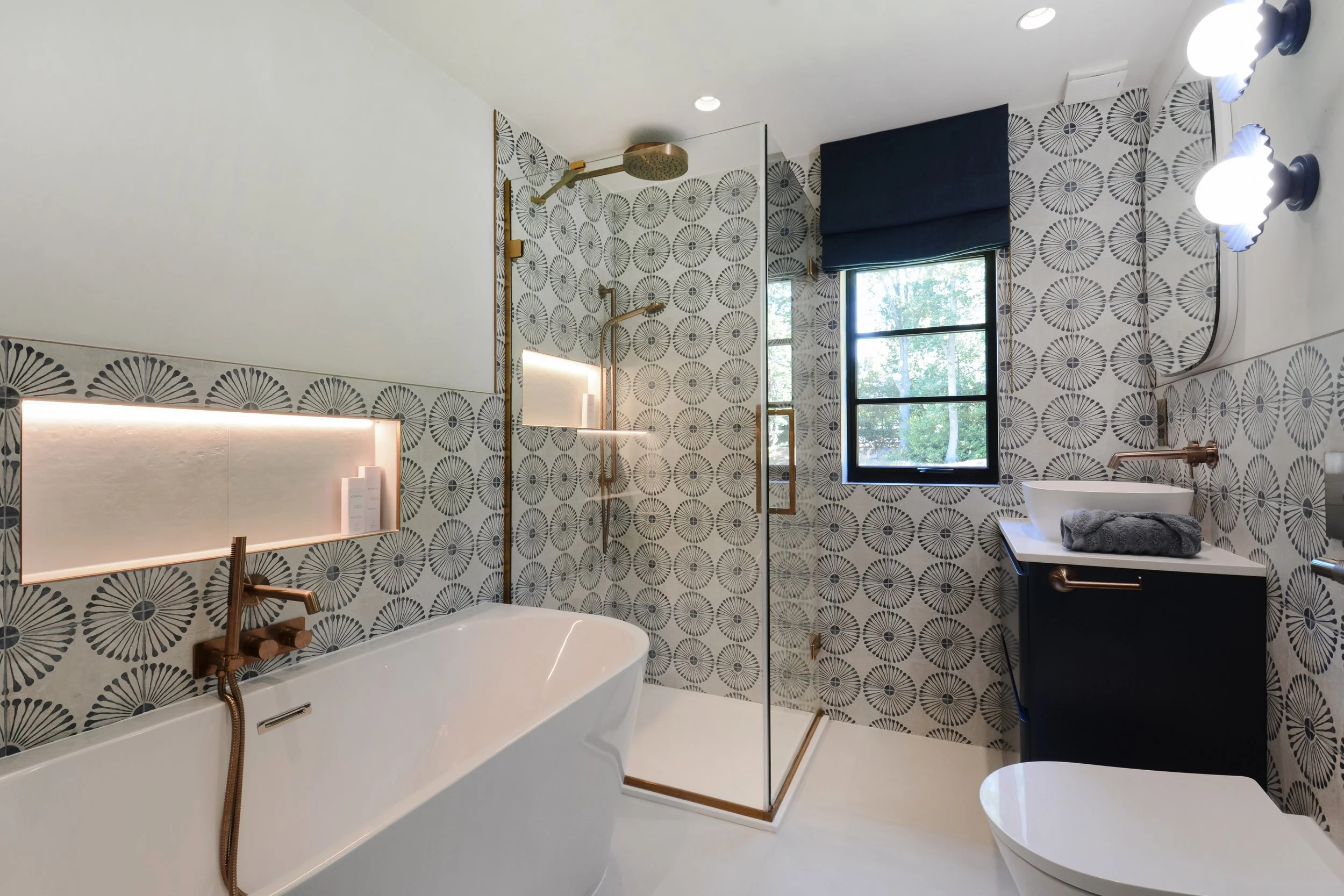 The family bathroom is relaxed while still reflecting the vibrant style of the house