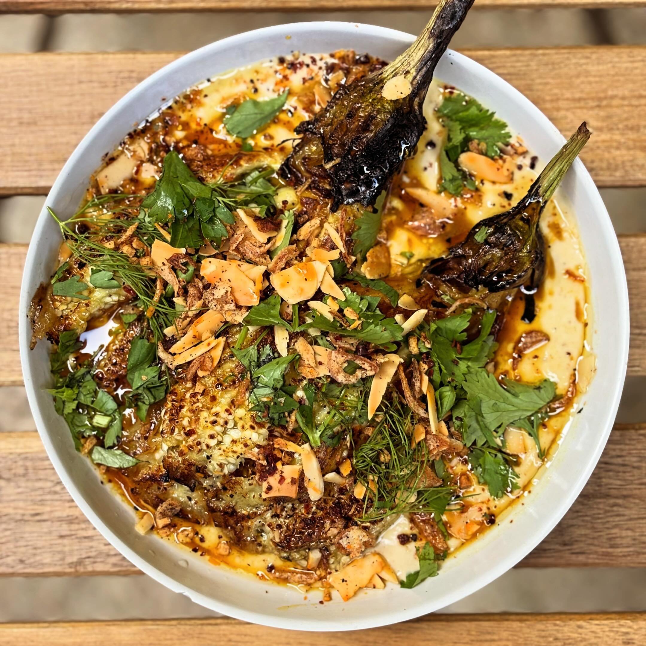 GRIDDLED EGGPLANT @hio_farm eggplant, tahini, hawaij honey, herbs and crunchy stuff