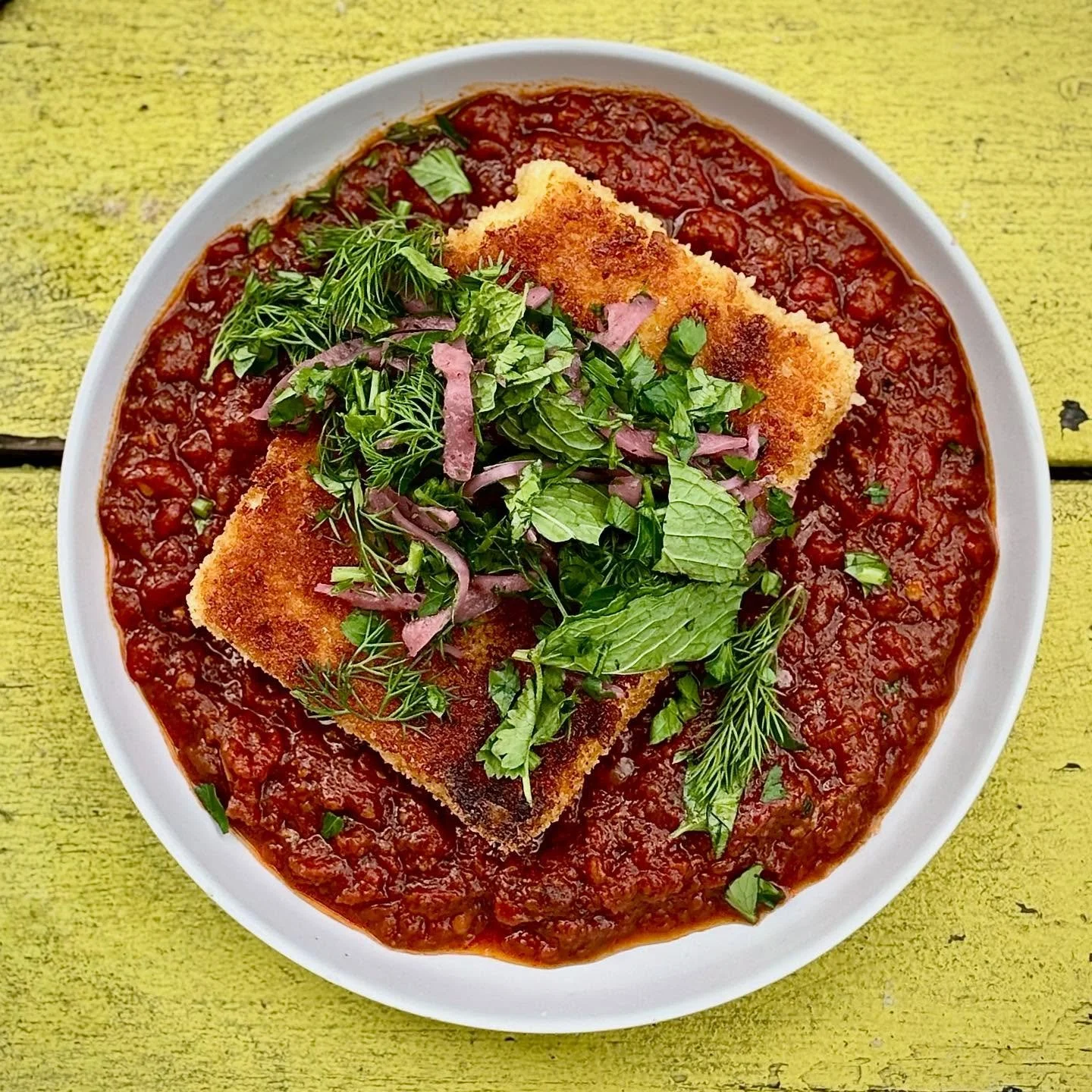 HOT CHEESE! Crispy griddle fried Bulgarian feta, spicy tomato situation, sumac onion, herbs