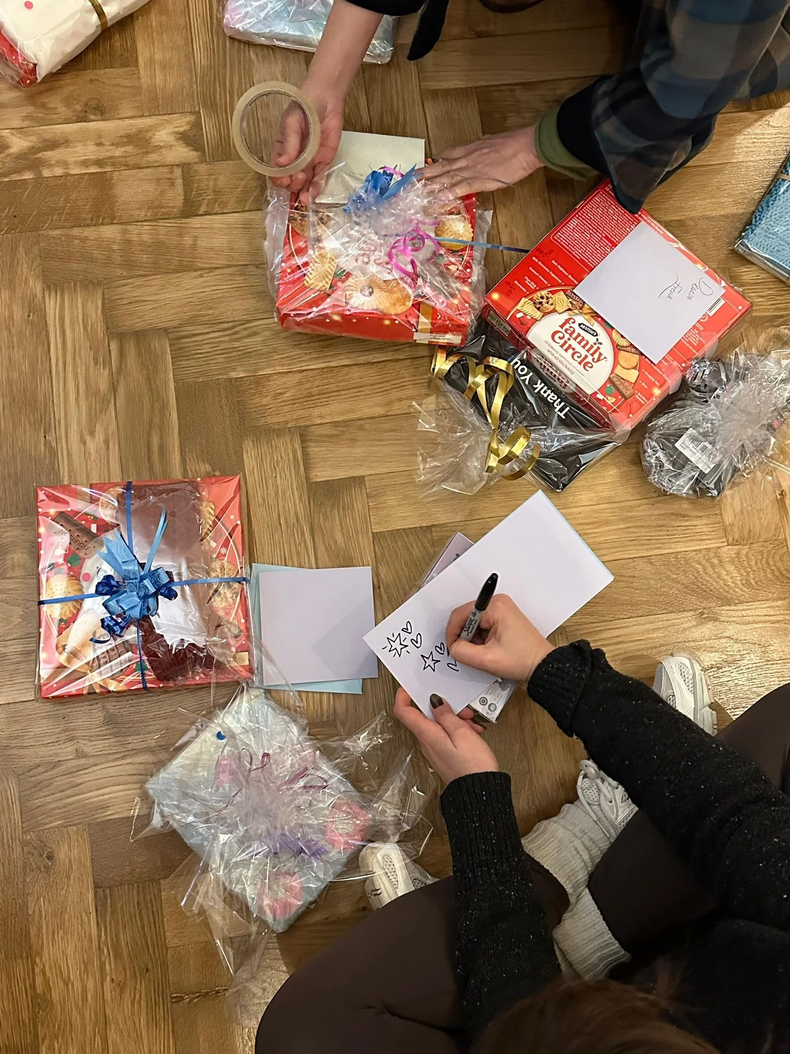 London community outreach 3- 100+ volunteers wrapped over 300 holiday gift , along with the Tale of the Other Glove, for disadvantaged youths.jpeg