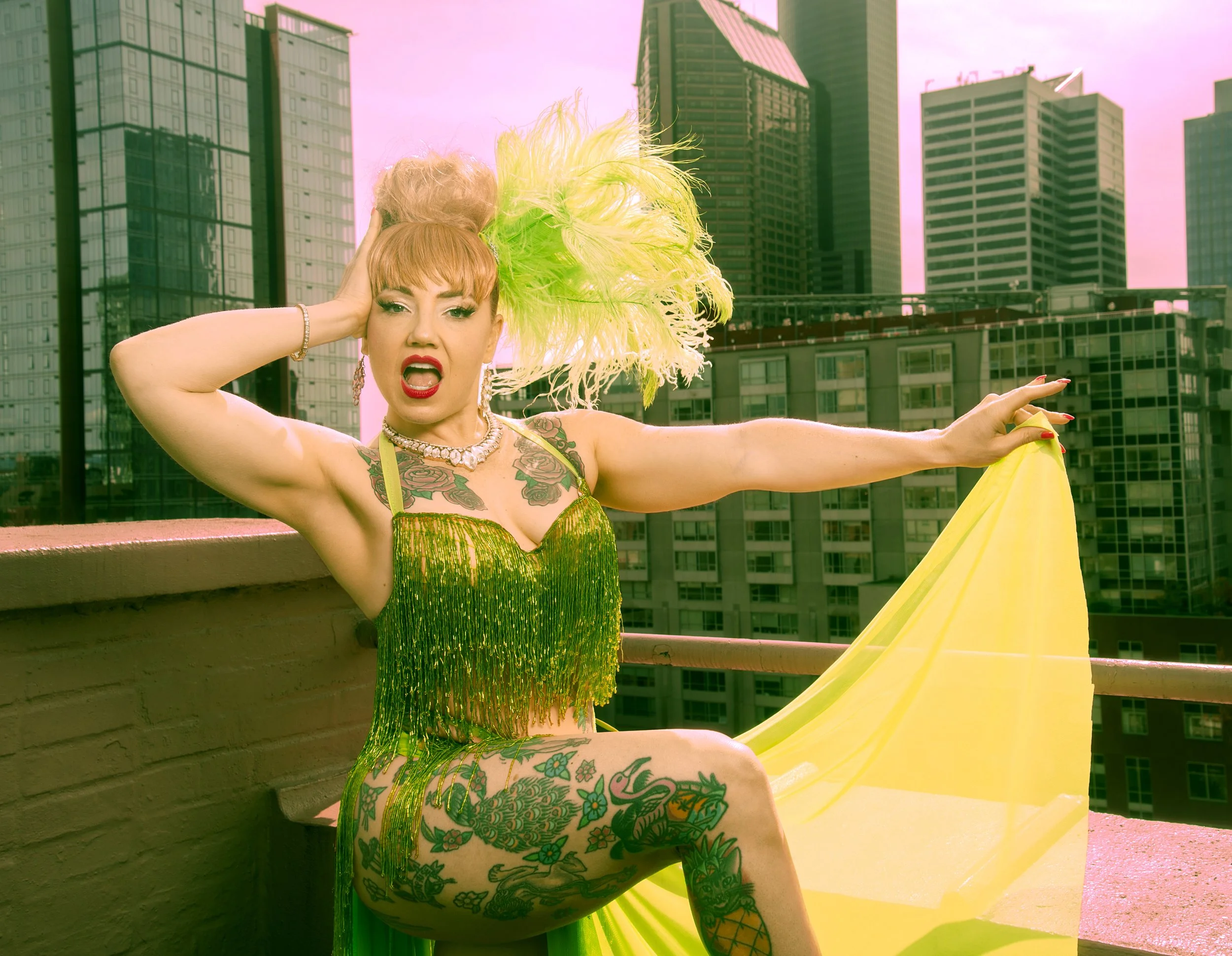 A woman with blonde hair in a bun outside of a building in seattle in a vintage beaded costume
