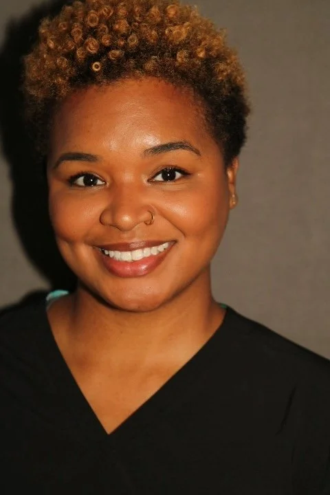 Delona Bean as Docent