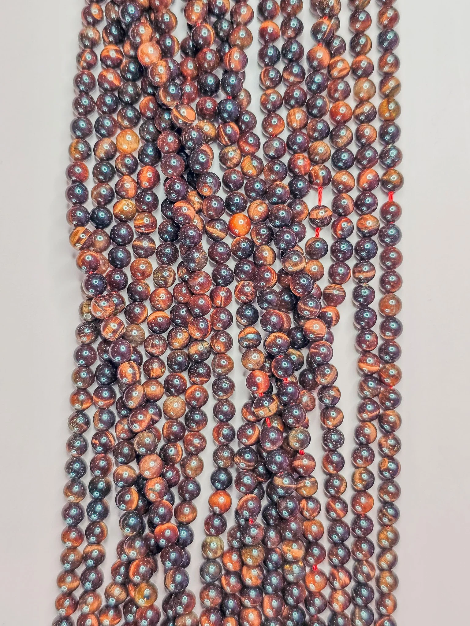 4 millimeter red tiger's eye round beads (heated)