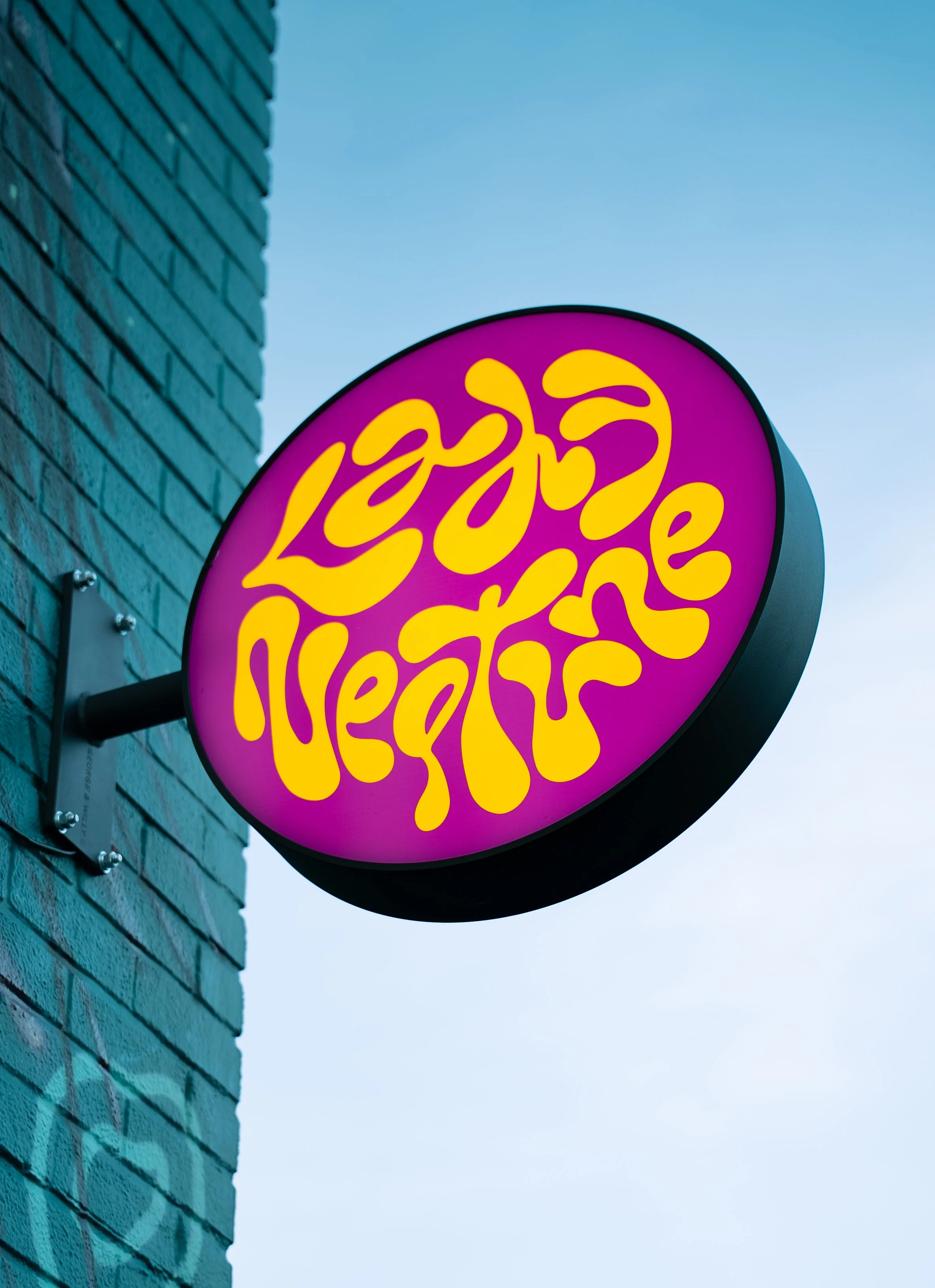 This is the funky looking purple and tangerine sign at the front of the Capitol Hill location. This sign is bright to let customers know where we are located in Capitol Hill.