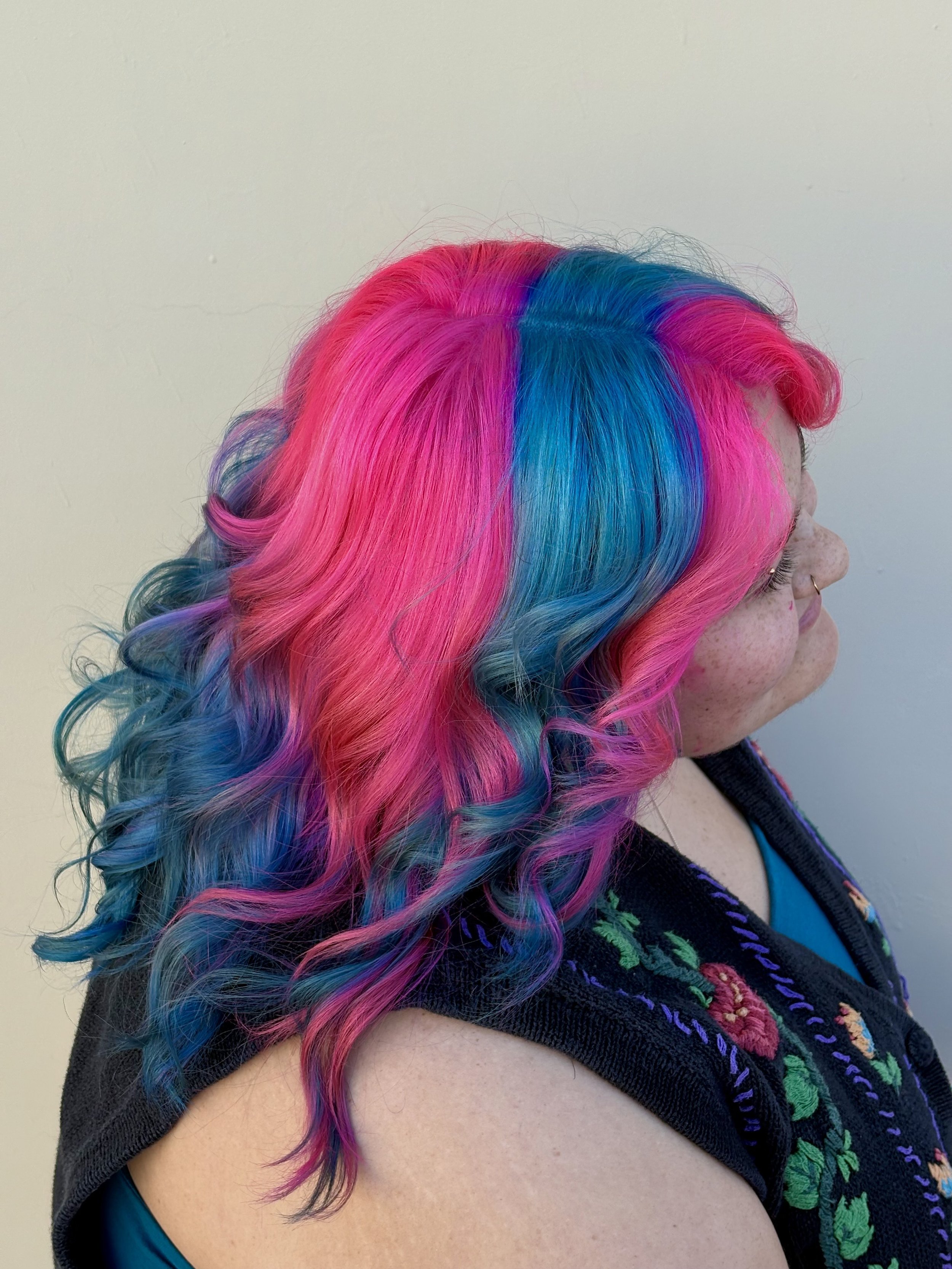 Lily is an expert at creating vivid hair color blocks on her clients. This is a delicious pink and blue bubblegum hair inspo.