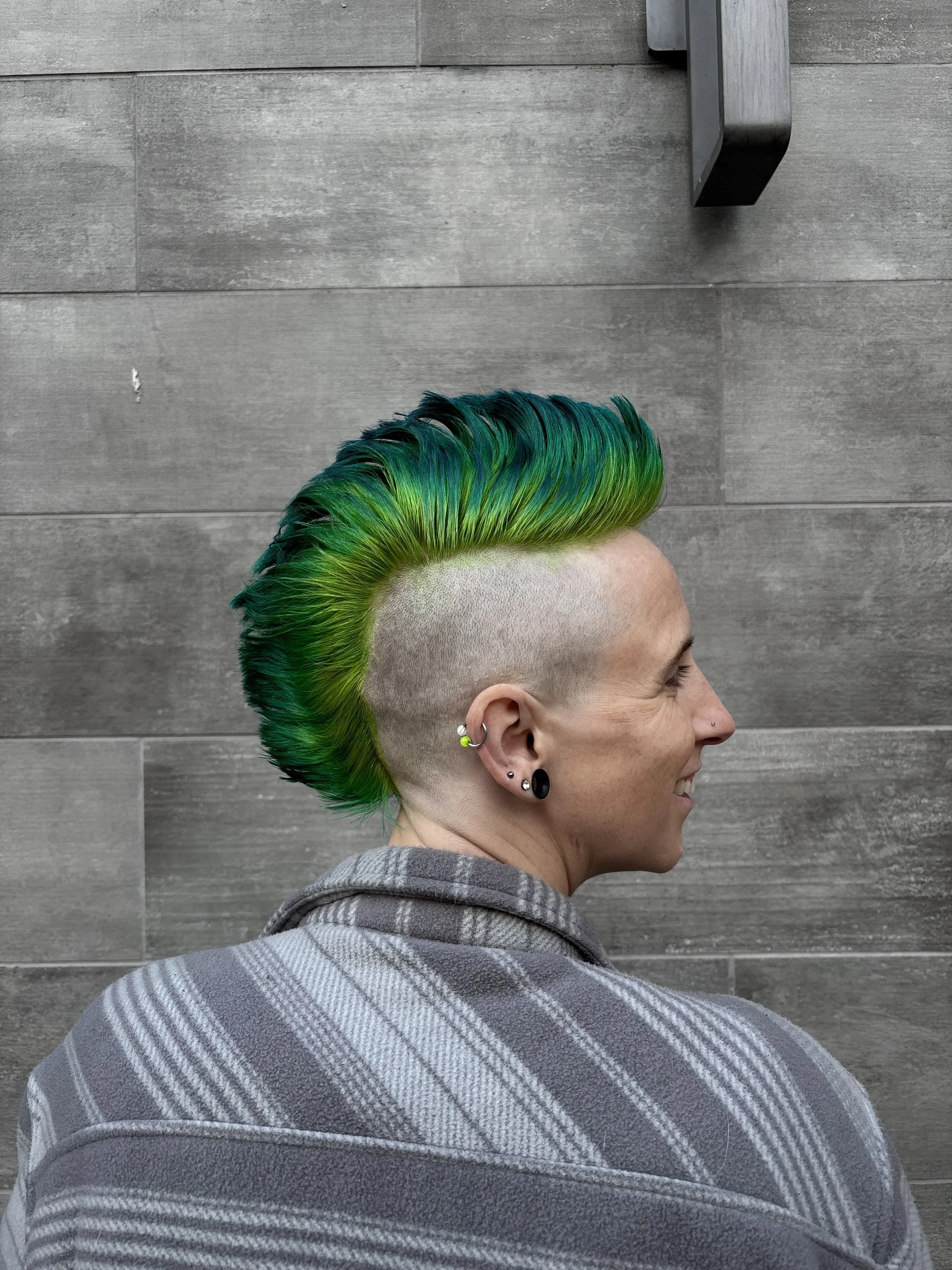 This green mohawk captures the magic that Kasie creates with all of their clients.