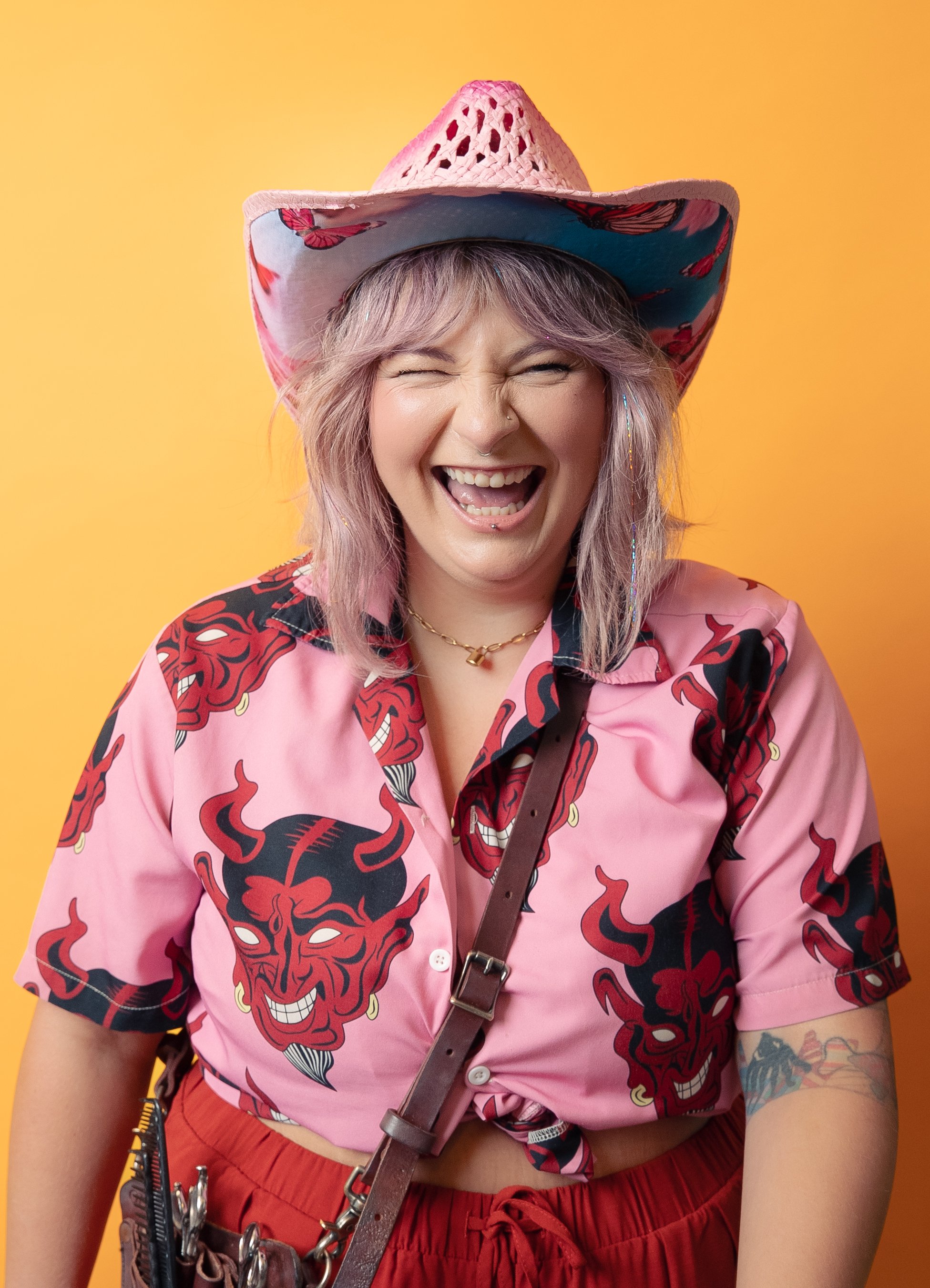 Coral is one of the best hairstylists in Seattle and specializes in razor-cutting, vivid colors, and gender-affirming haircuts. If you're looking for a creative cut that makes you feel more like yourself, Al is the one to book with at Lady Neptune!