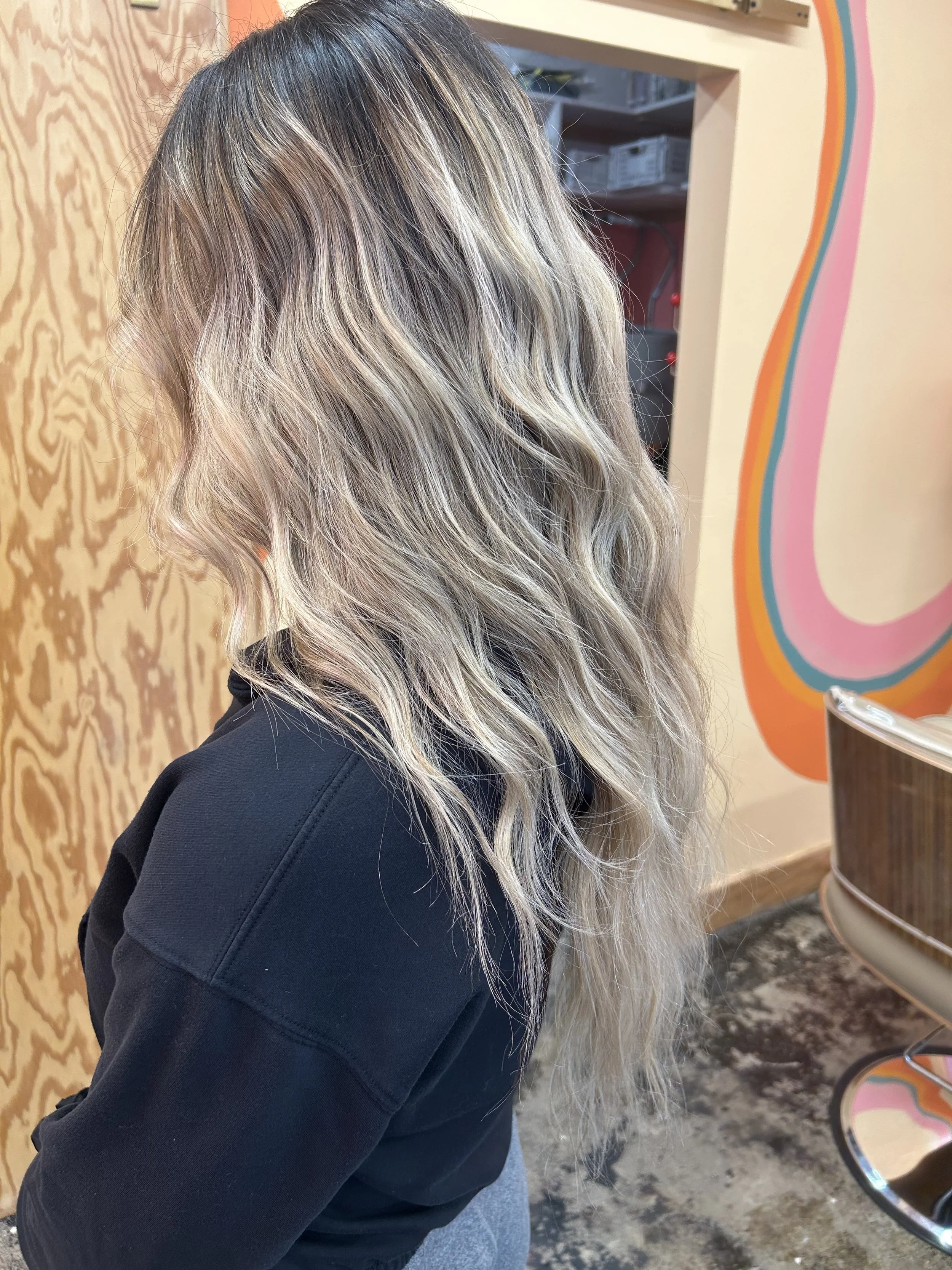 What clients come to Cory for again and again is her balayage and lived-in blonde and bronde looks in Seattle.