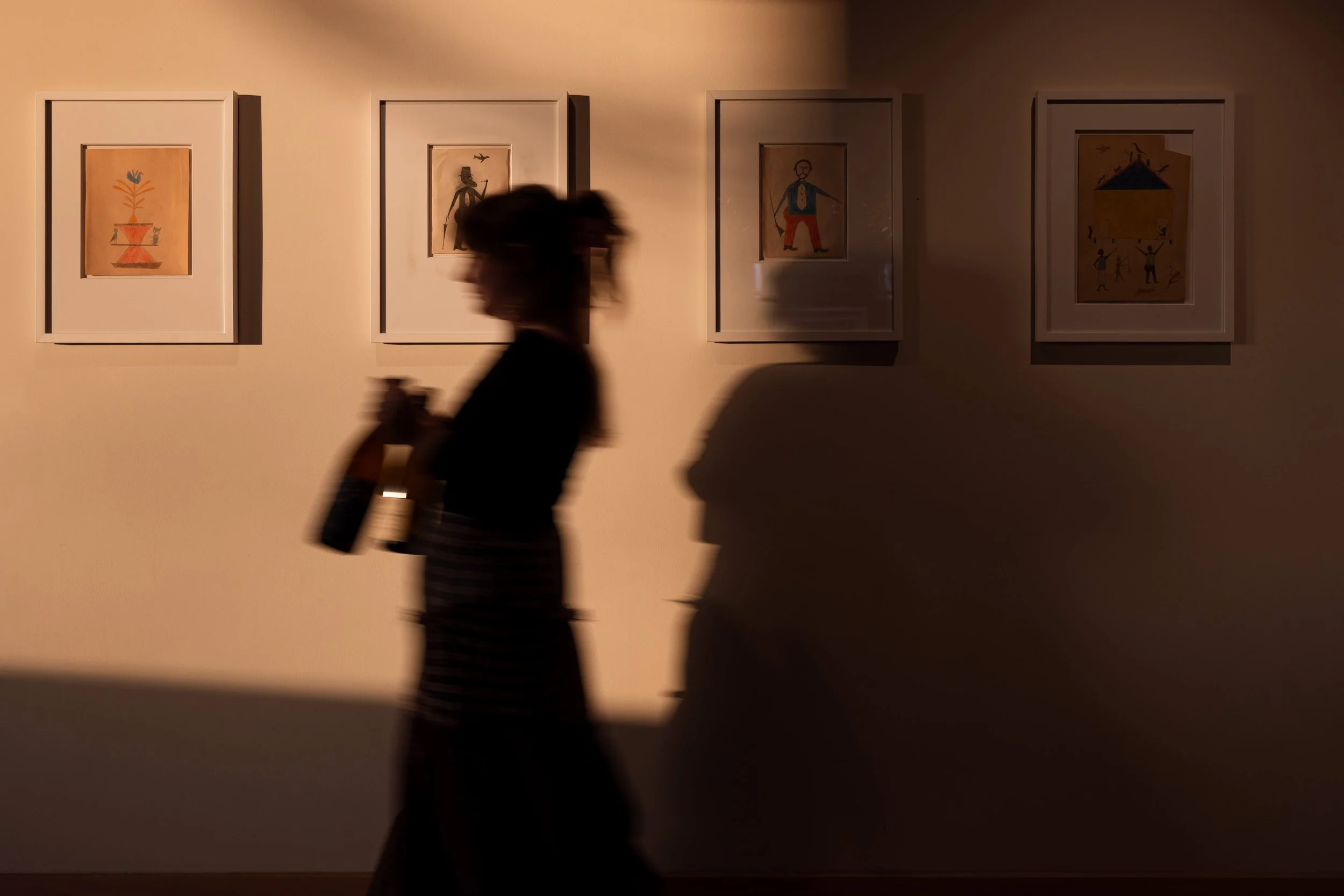 women-carrying-wine-bottle-shadow.jpg