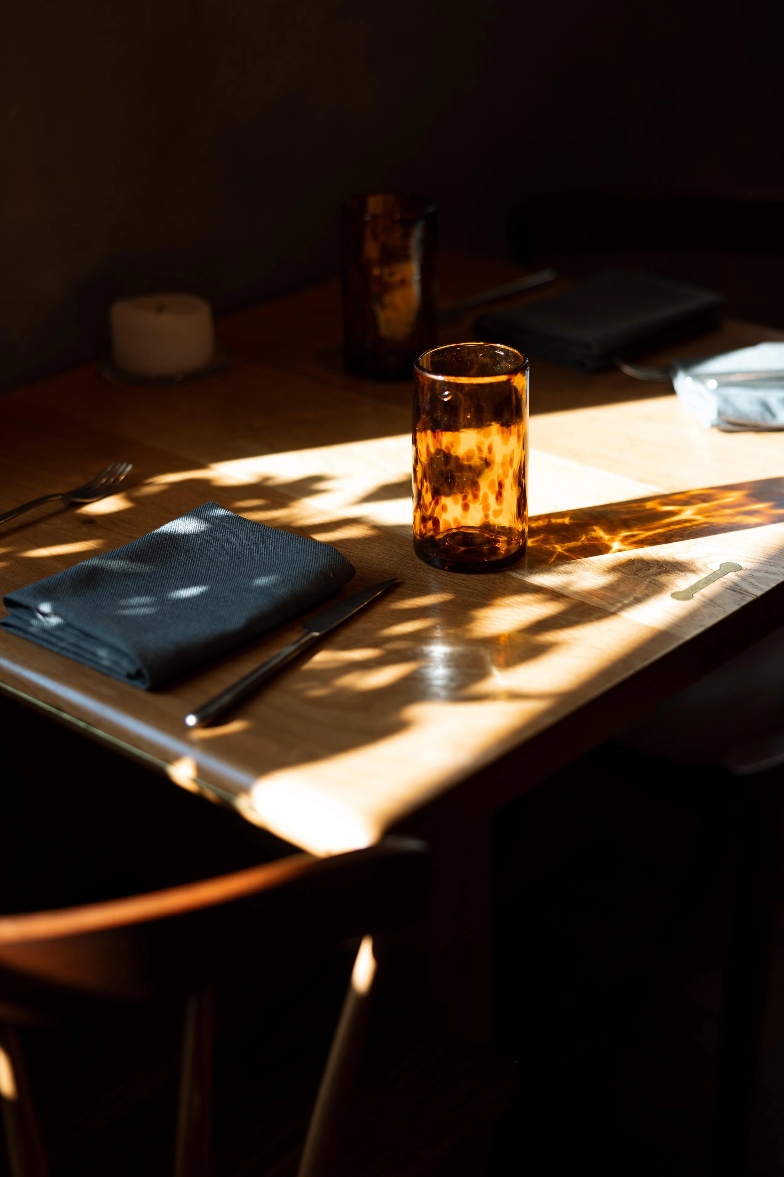 shadow-across-table-scape-glass.jpg
