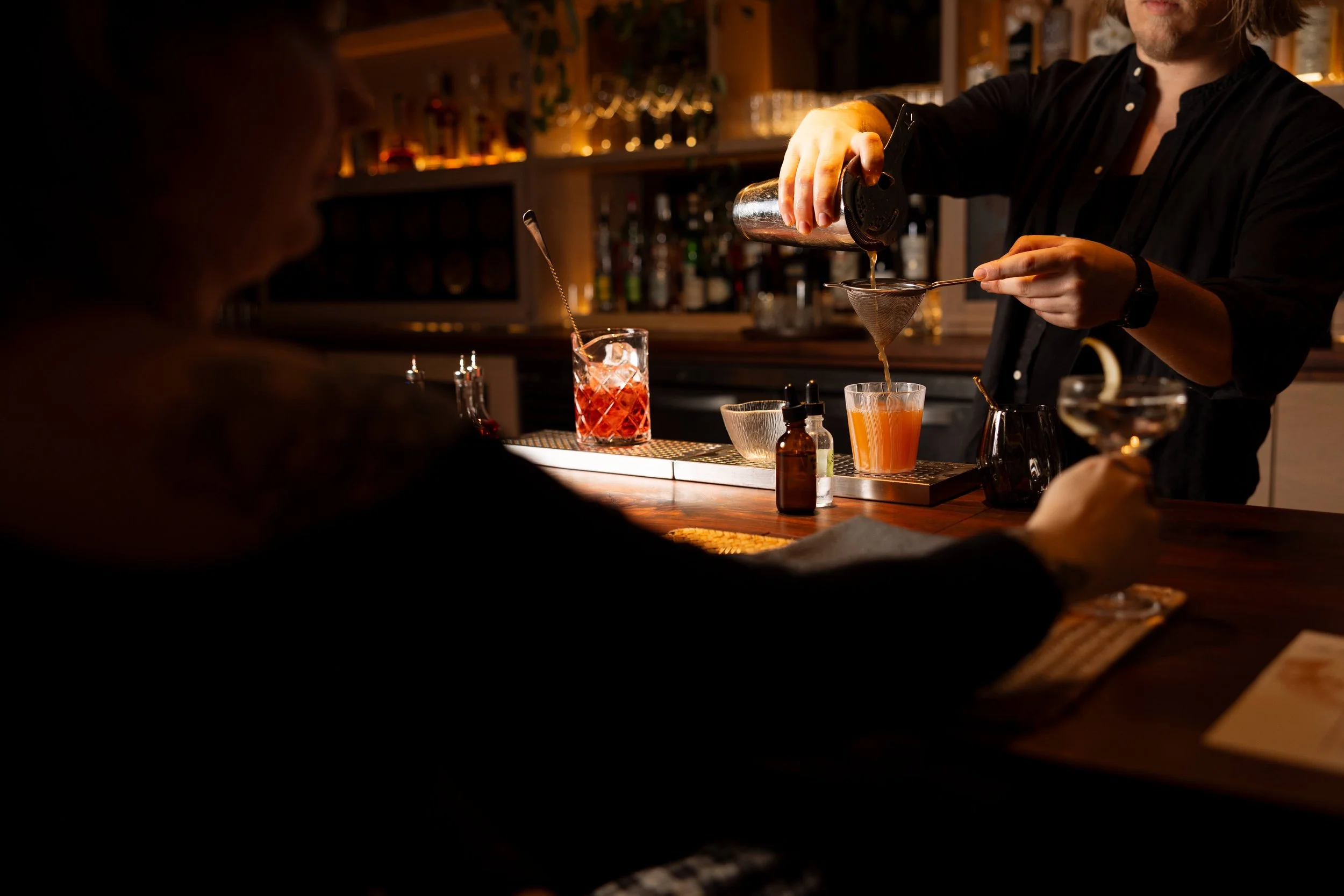 bartender-pouring-cocktail-orange.jpg