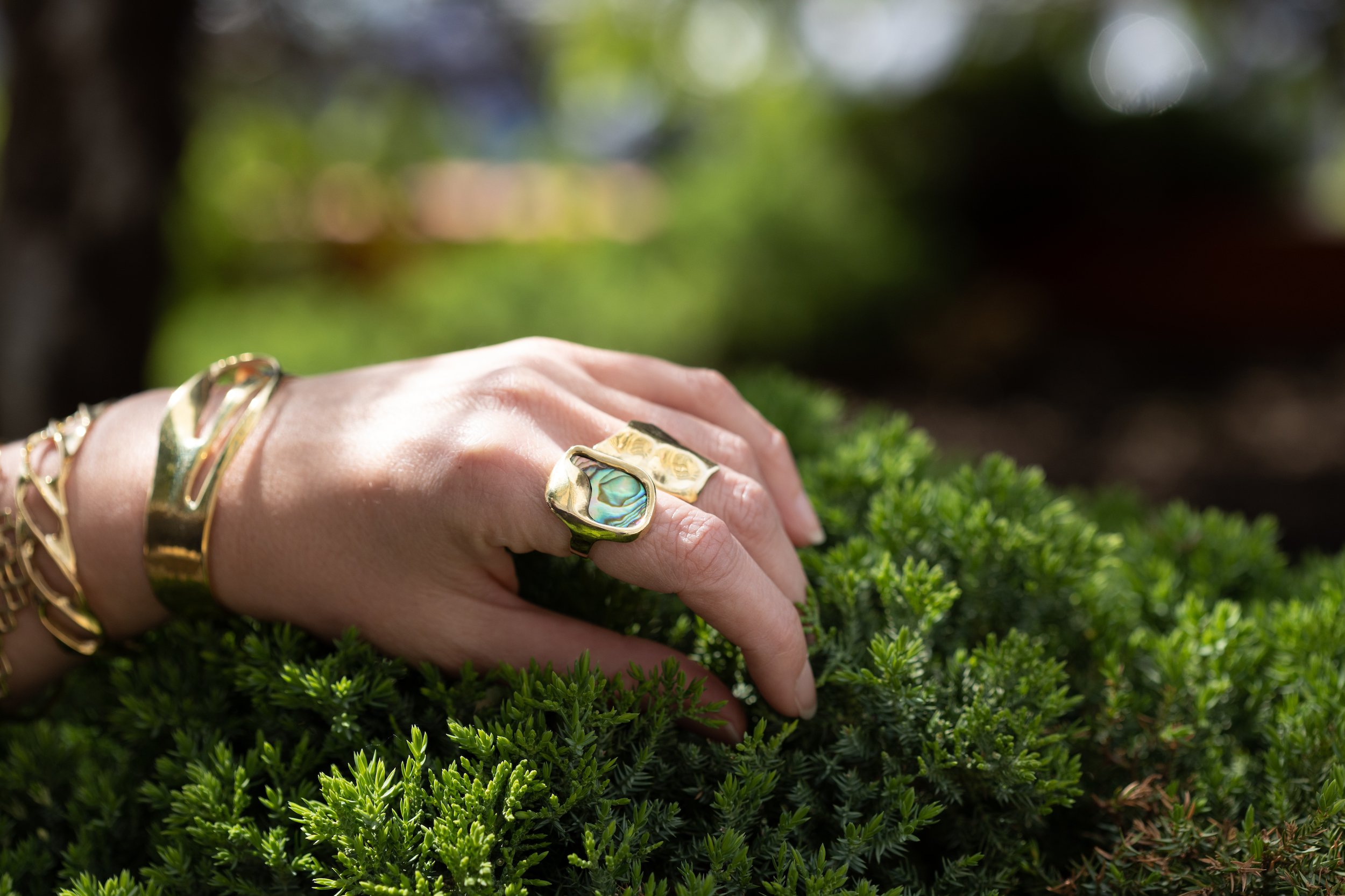   Sailor Knot Bracelet  ($215),  Twist Cuff  ($300),  Sea Glass Ring  (from $160),  Wave Ring  (from $230) 