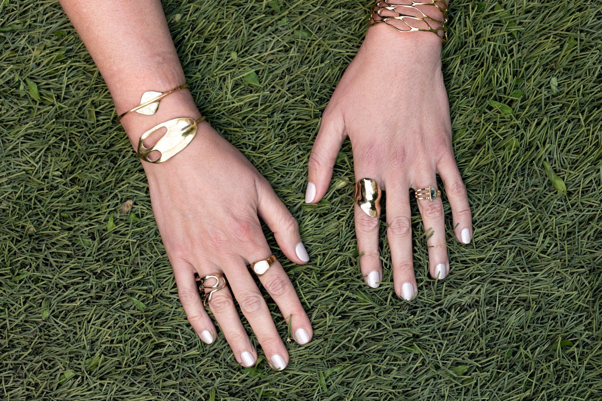  (left hand)  Net Cuff  ($300),  Bubble Ring  (from $165),  Reverberation Ring  (from $195); (right hand)  Moth Cuff  ($235),  Eero Cuff  ($190)  Wrap Ring  (from $170),  Shield Ring with Shell  (from $250)&nbsp; 