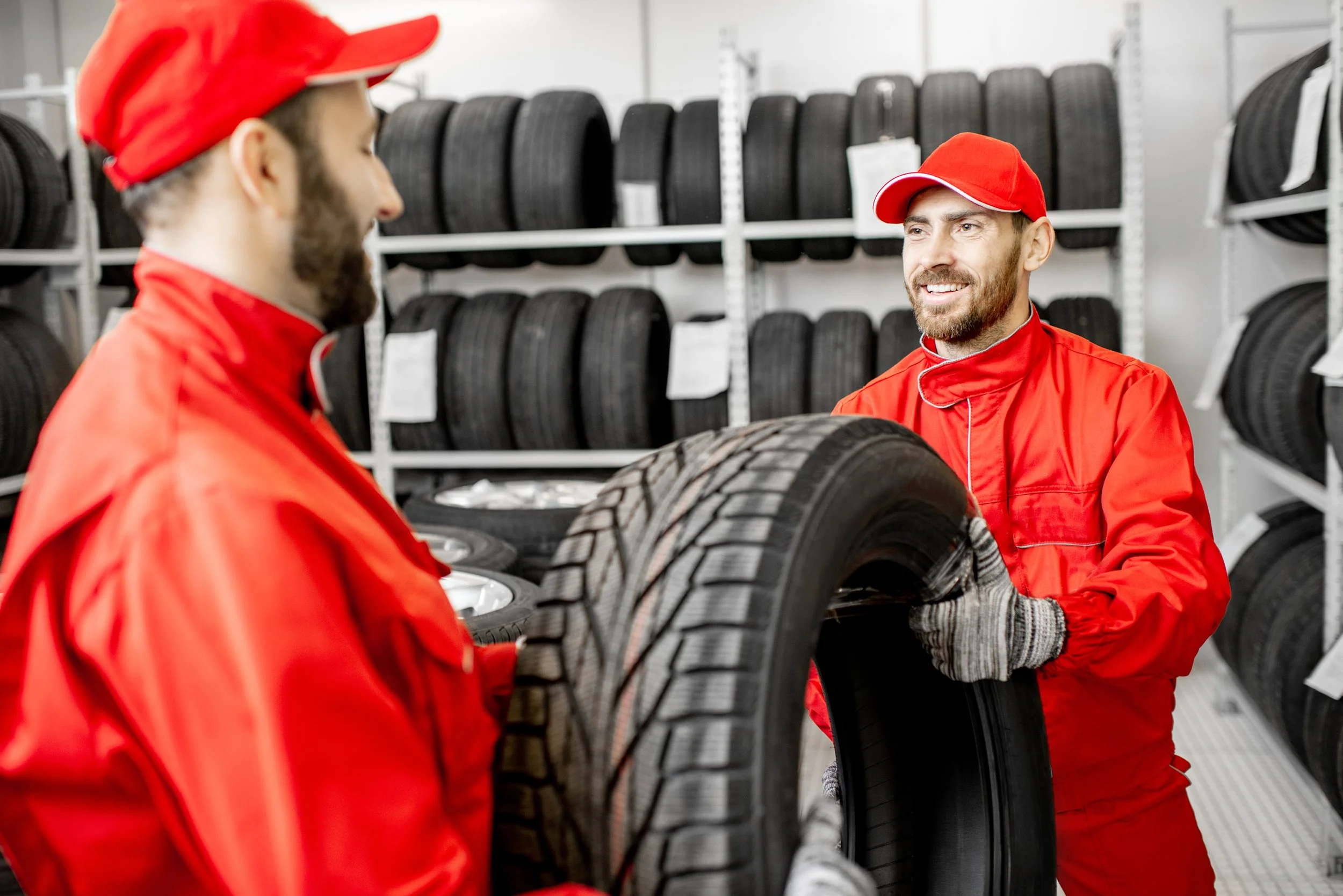 men-working-in-the-warehouse-with-tires Reduced.jpg