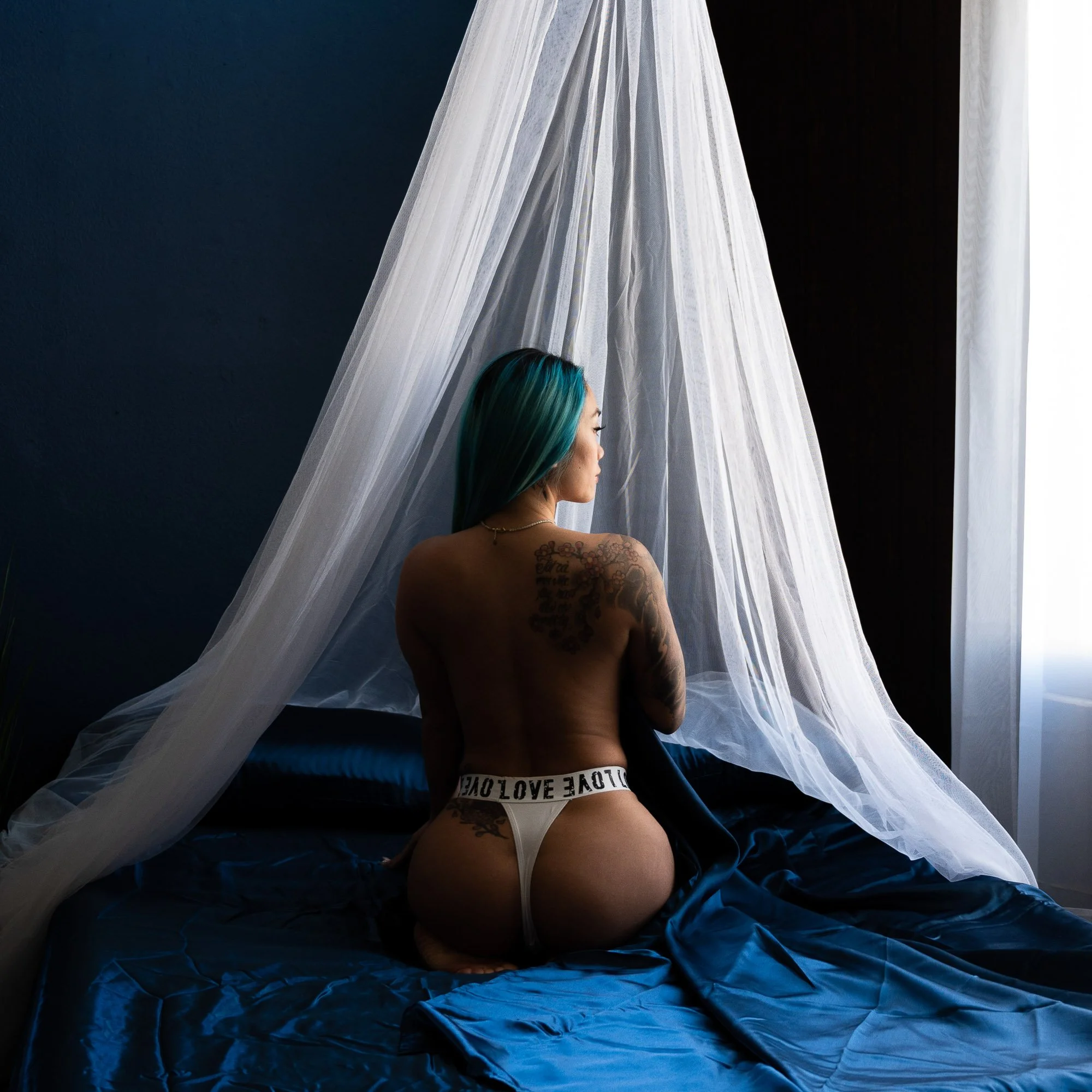 Woman posing confidently during a boudoir session at Black Kat Studios in Los Angeles