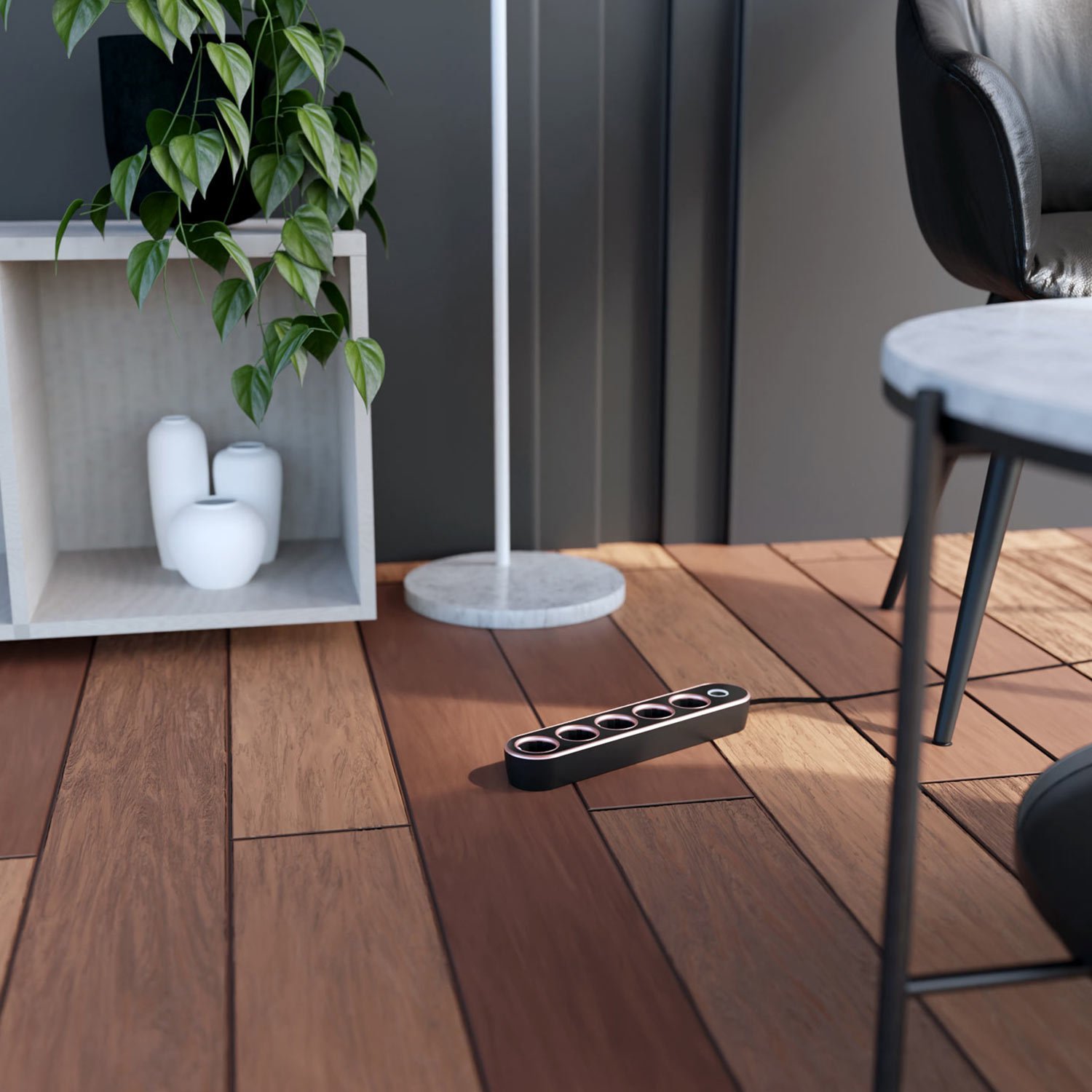 The Luxury power extension lead in black and rose on the floor