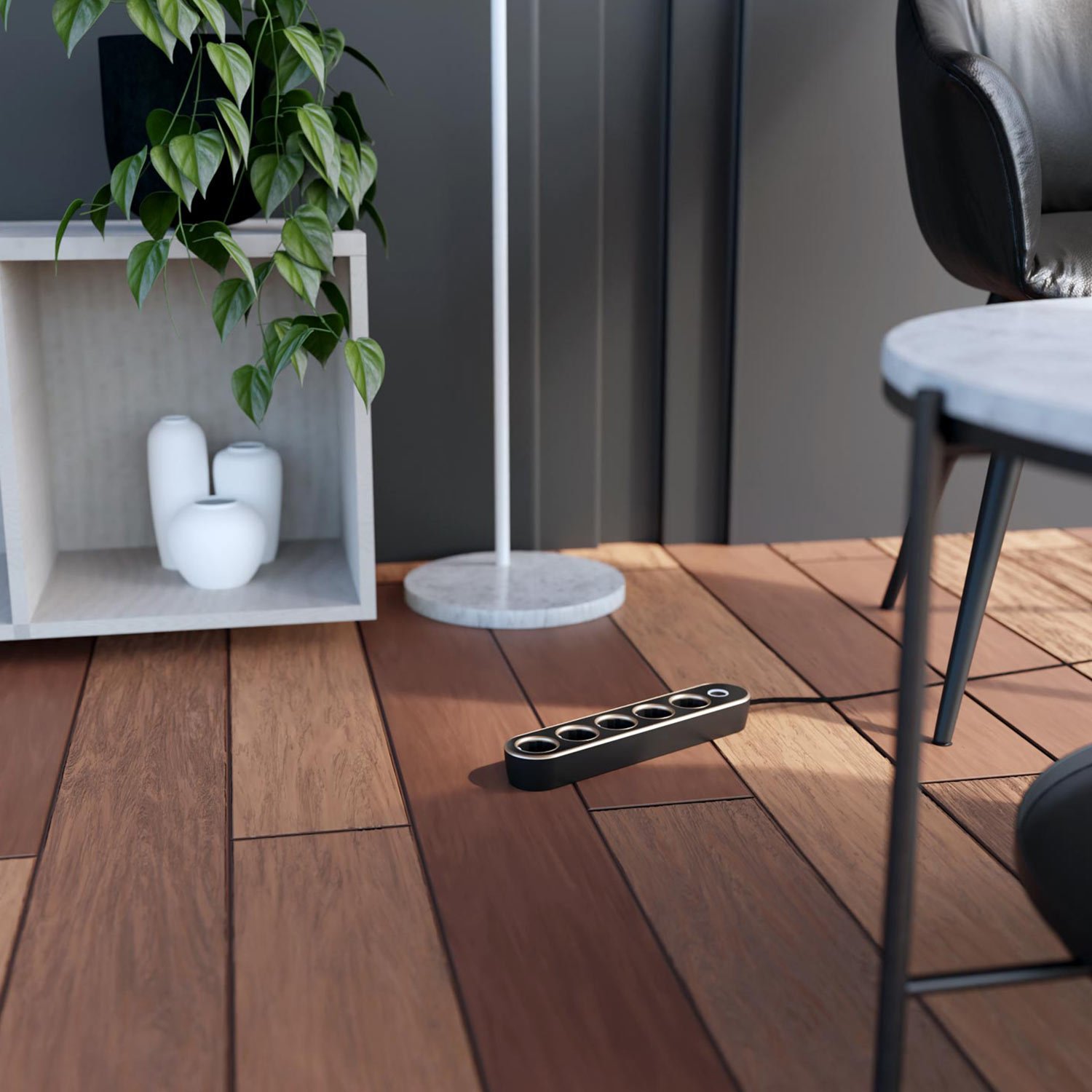 The Luxury power extension lead in white and gold on the floor