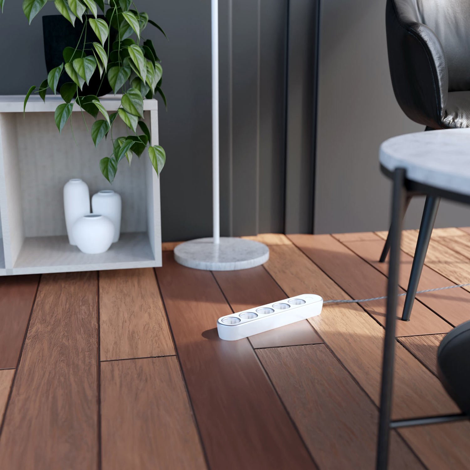 In use on the floor luxe power strip in silver and white