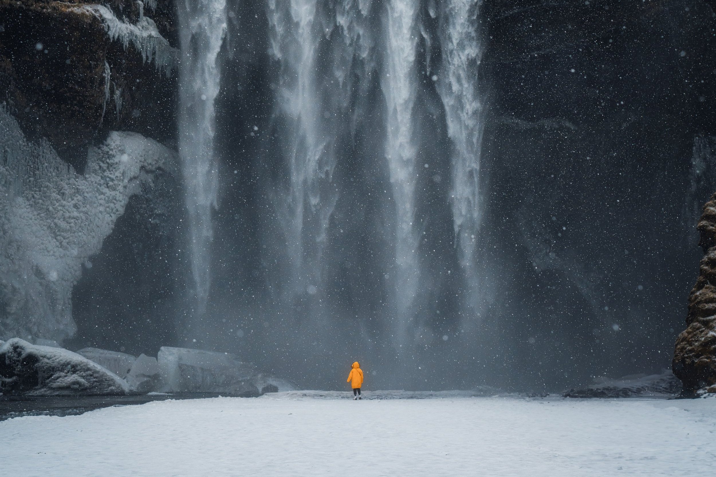 Iceland+-+Skogafoss+yellow+jacket+snow+1.1.jpg