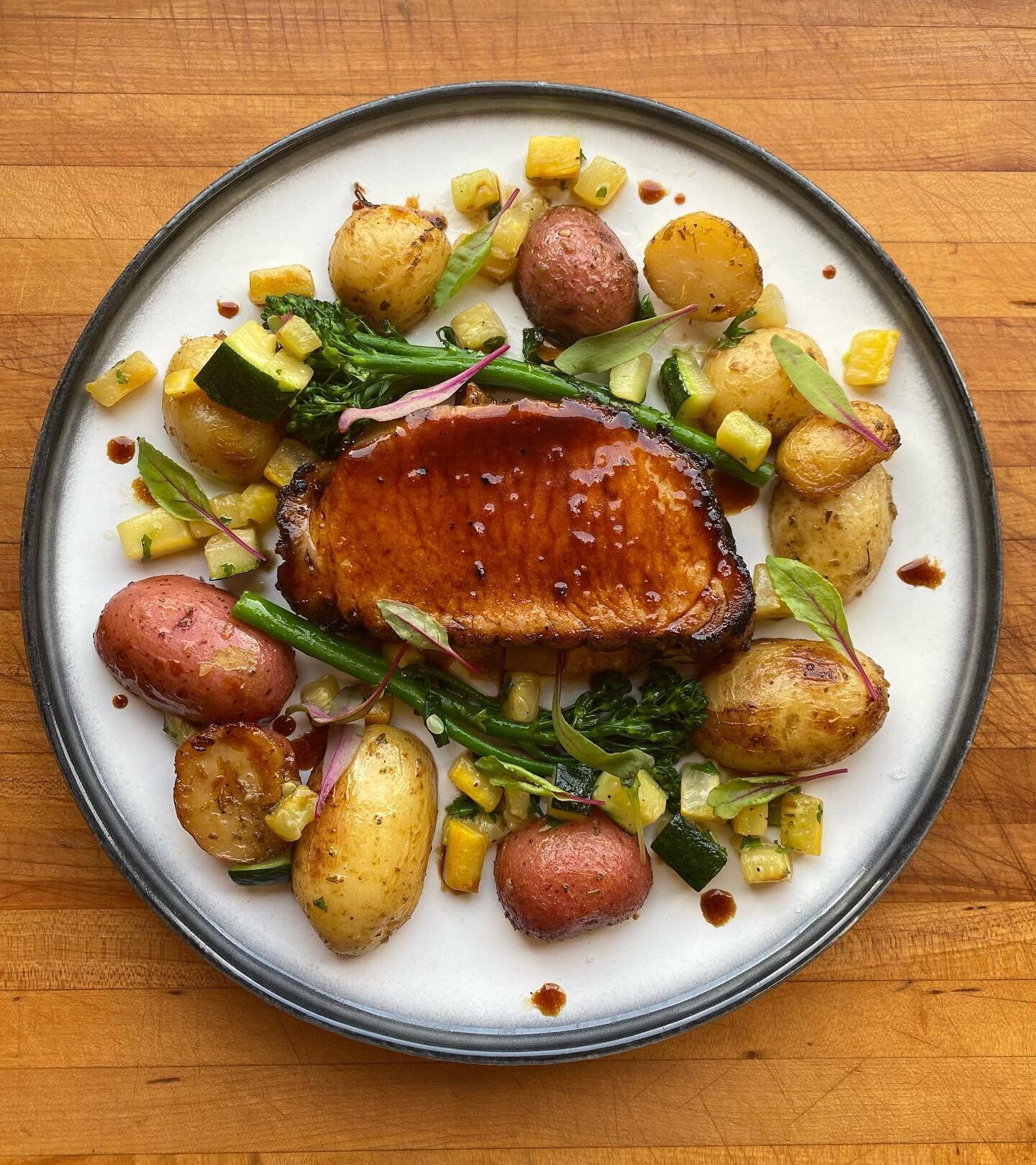 This weeks feature is a roasted pork lion with pork red wine jus reduction, broccolini, summer squash, lemon duck confit potatos.