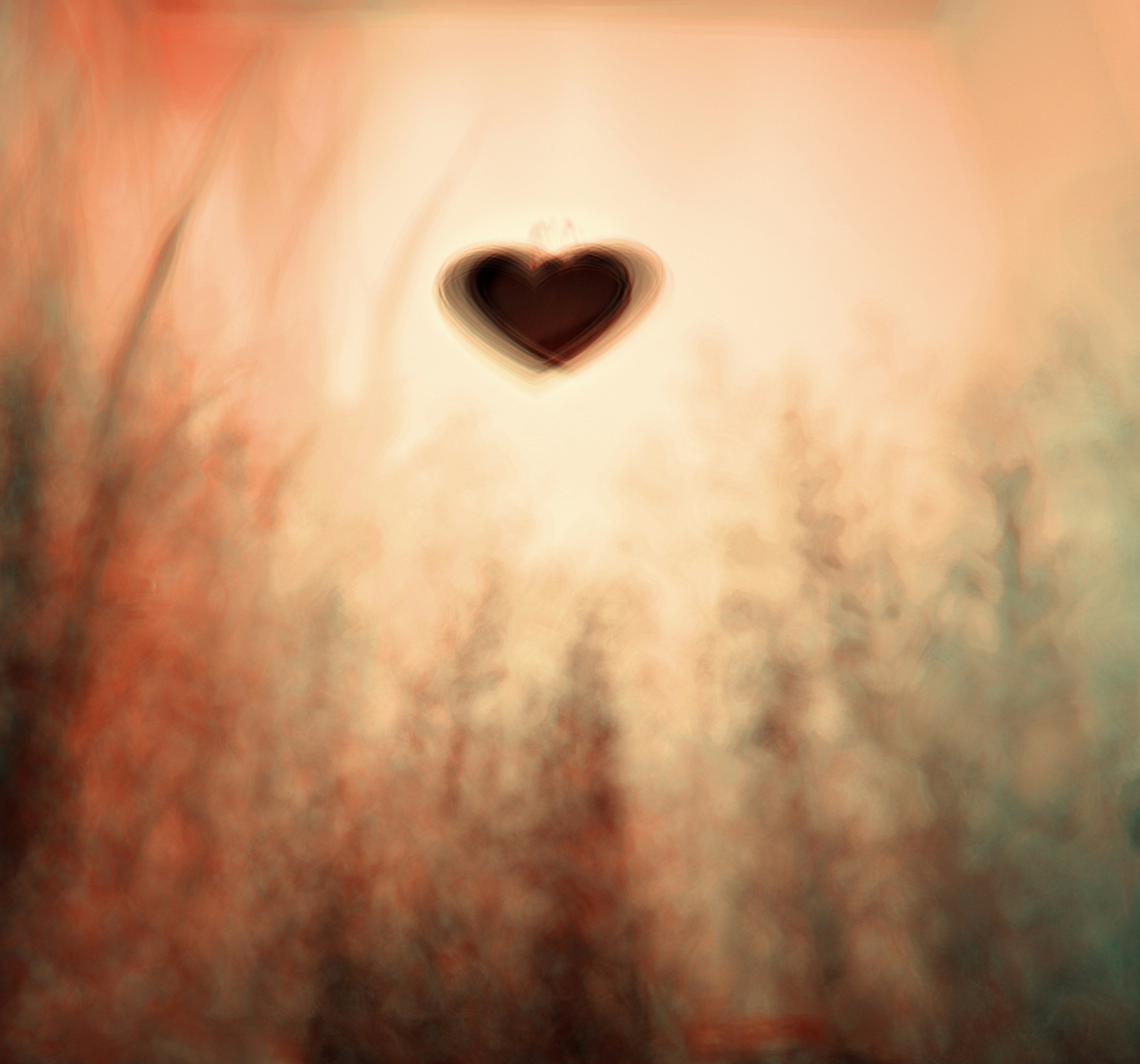 Close-up of a person's skin with a small, dark heart-shaped birthmark in the center.