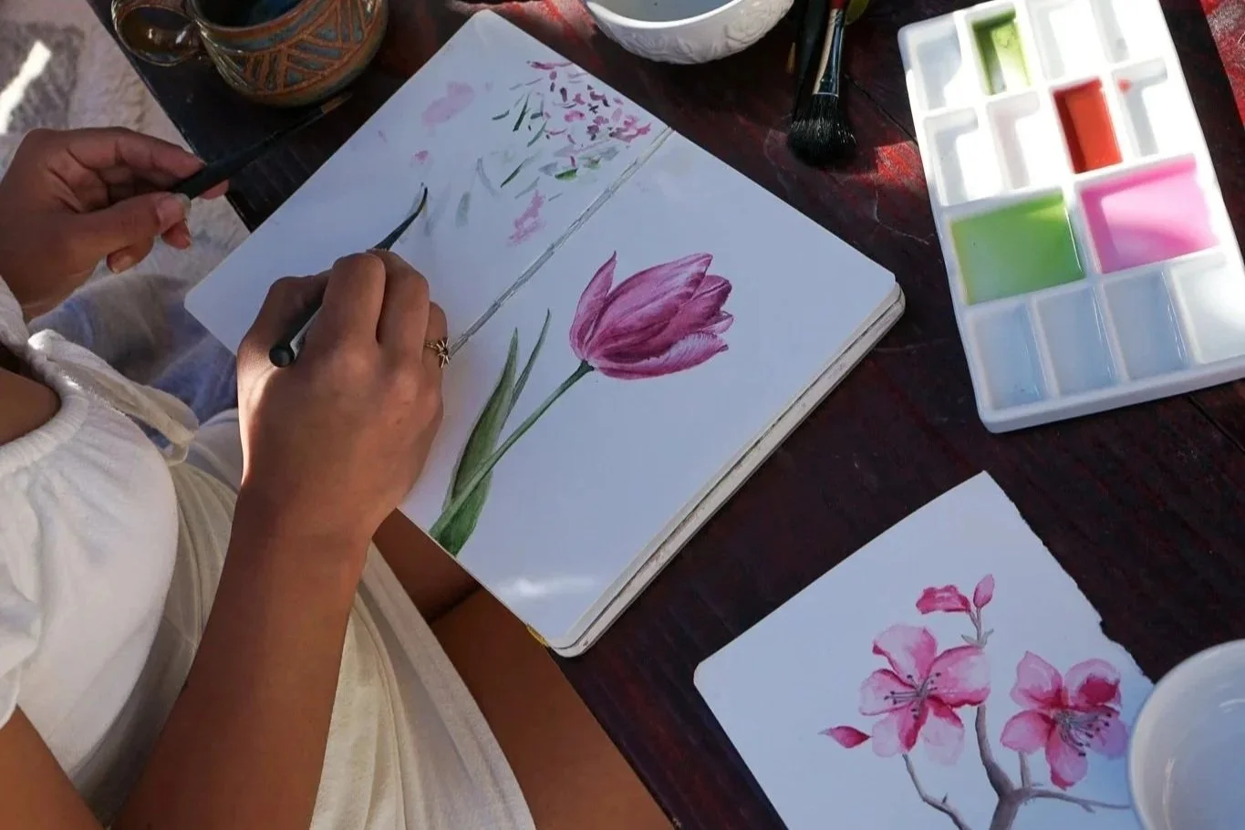 learn how to paint flowers in a san diego watercolor class. Photo of watercolor tulip and cherry blossom