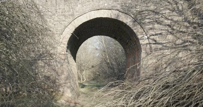 Stone arch over a cutting that once carried limestone and coal from the Durham dales to the Tyne. The railway opened in 1834 but didn&rsquo;t last long. The path now runs for miles through what the industry left behind. 

Still from Ghost Train, a do