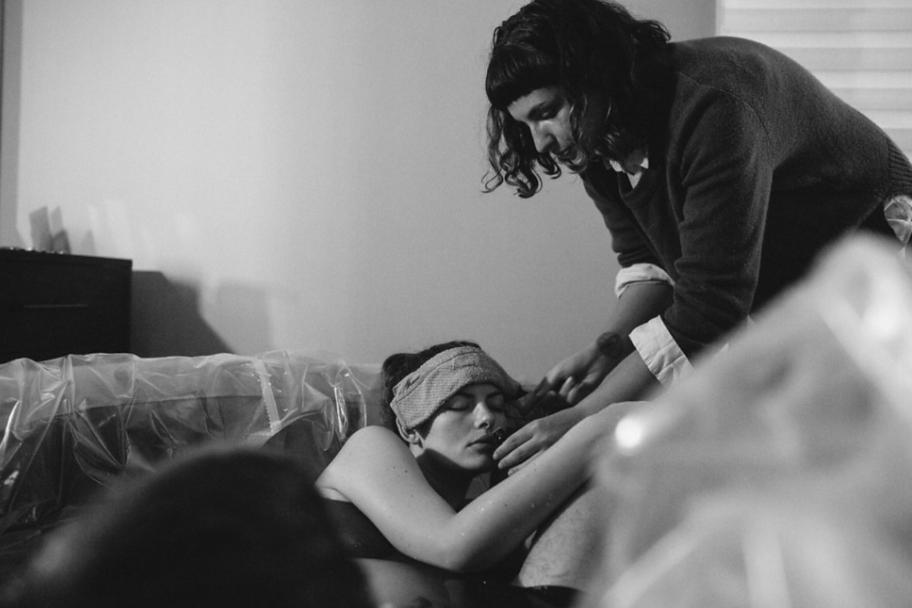 Roxy supporting doula client during labor