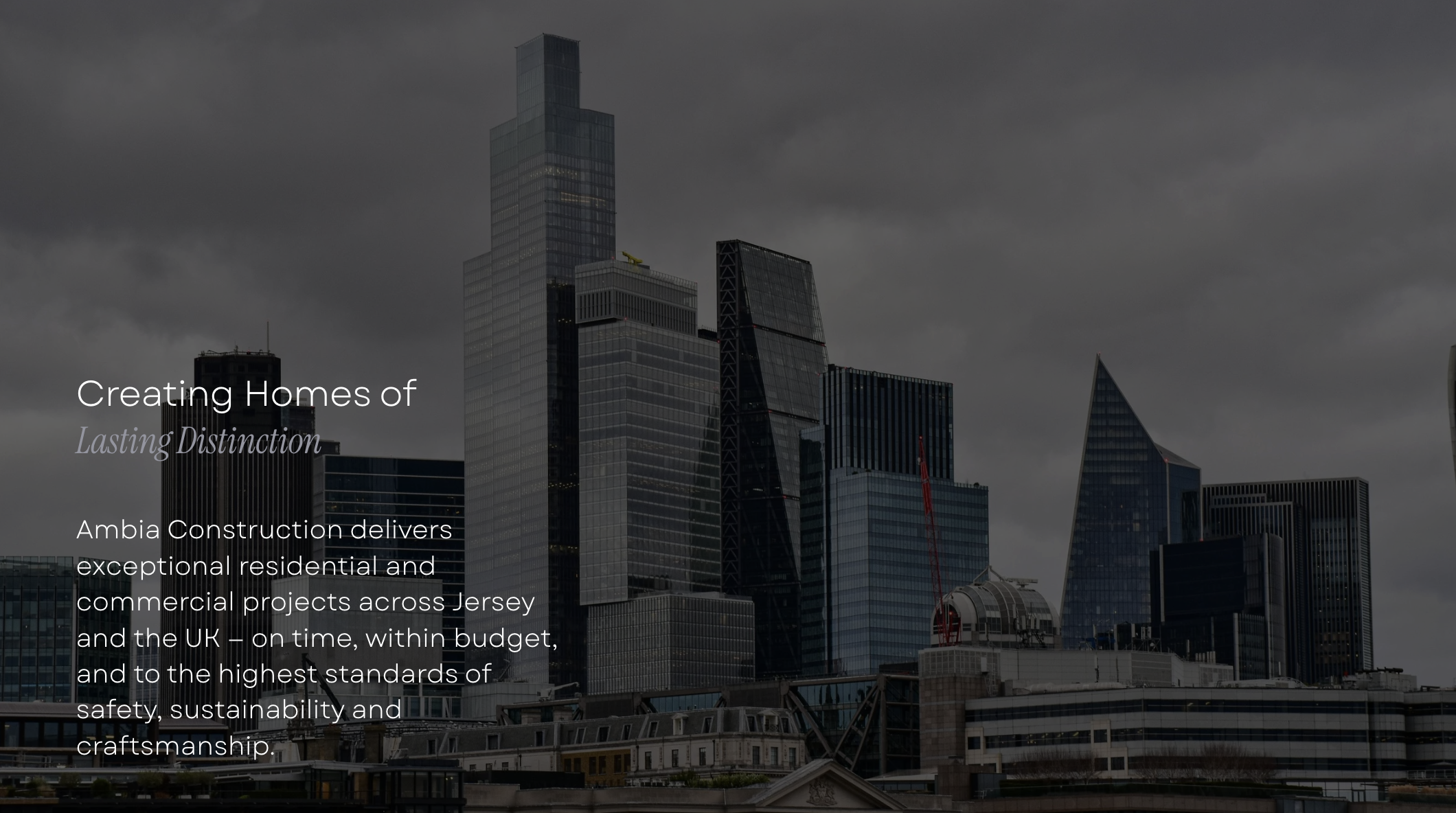 A city skyline with tall, modern skyscrapers under a cloudy sky.