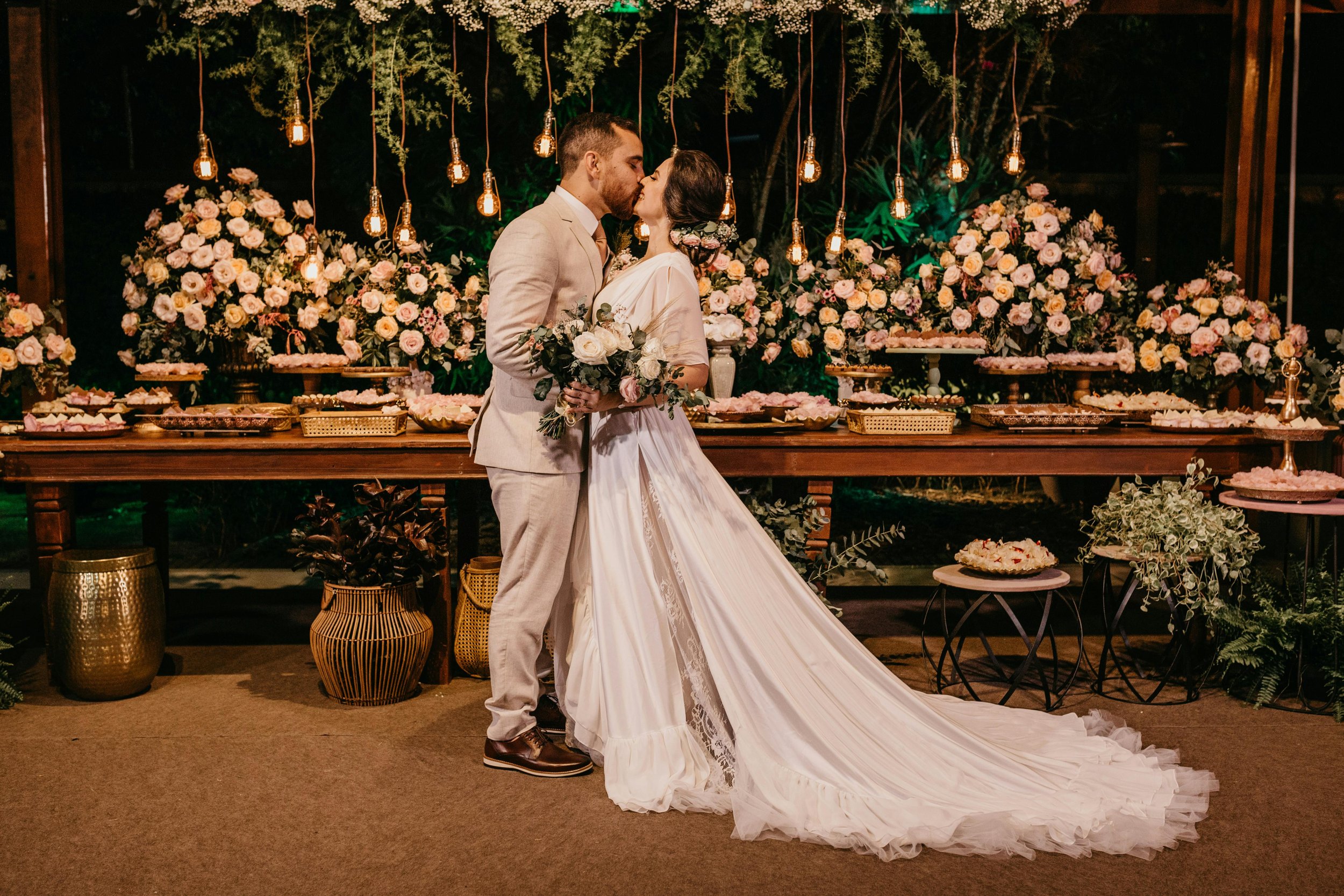 Bride and groom sharing first kiss at historic venue — wedding planned by Regal Rendezvous luxury event planner Baltimore