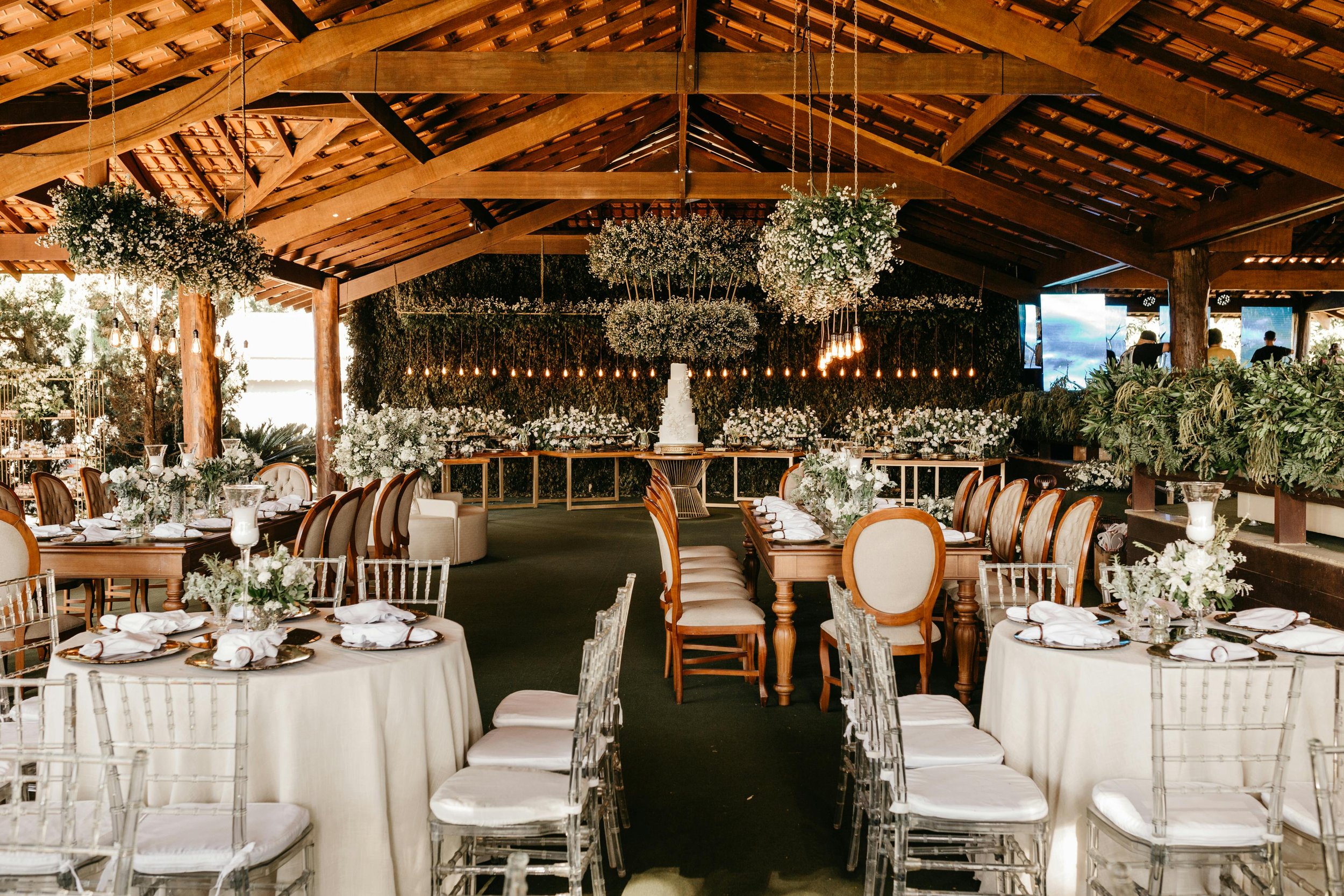 Elegant wedding reception table with white florals and candles styled by Regal Rendezvous event planner DMV
