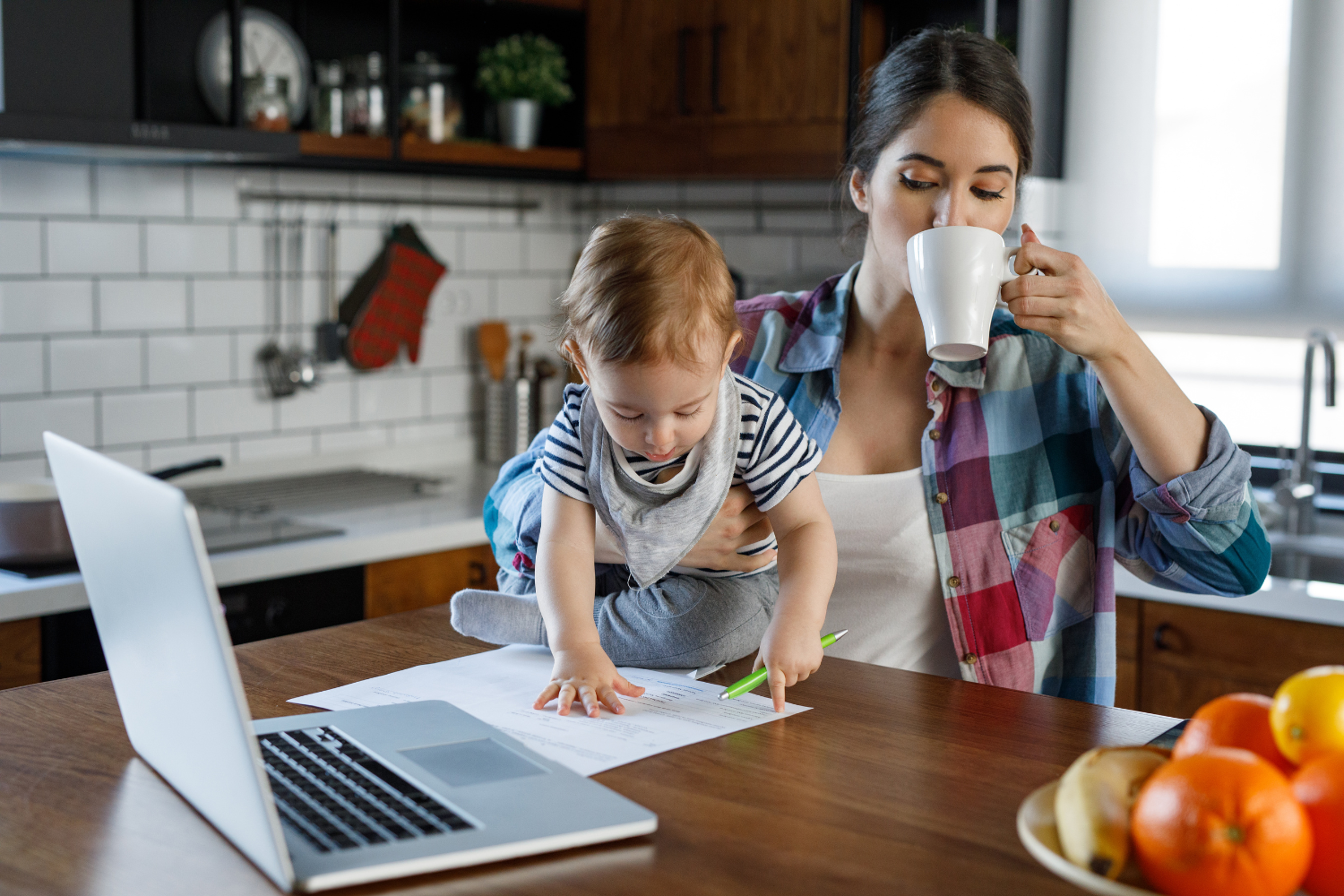 Woman carrying many responsibilities symbolizing the pressure many women feel to hold everything together.
