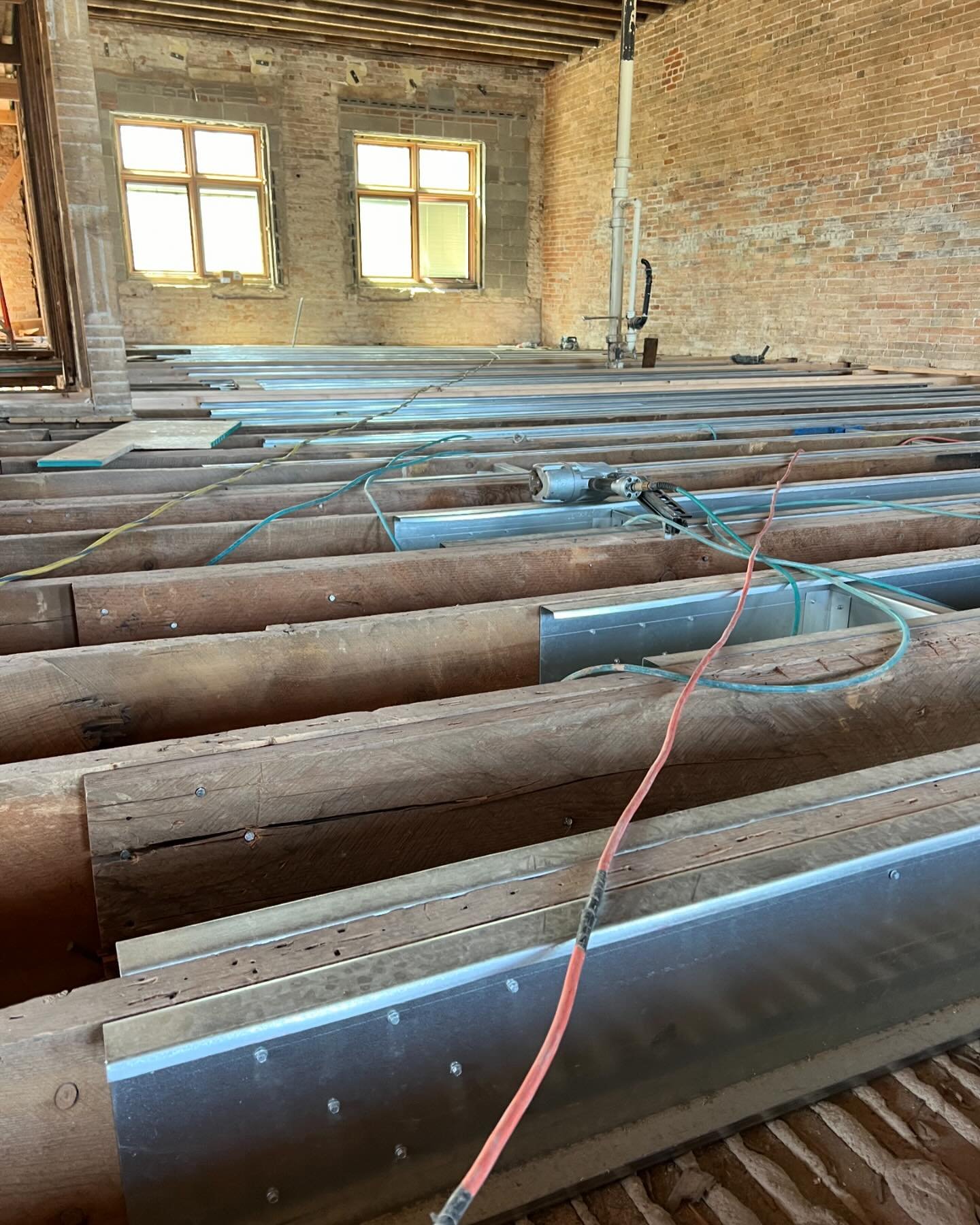 Sister from another mister! We've sistered or replaced a significant number of joists in the Main Street buildings. In an effort to not disturb the original plaster and tin ceiling below 360 Main, the carpenters used metal studs instead of wood. Seem
