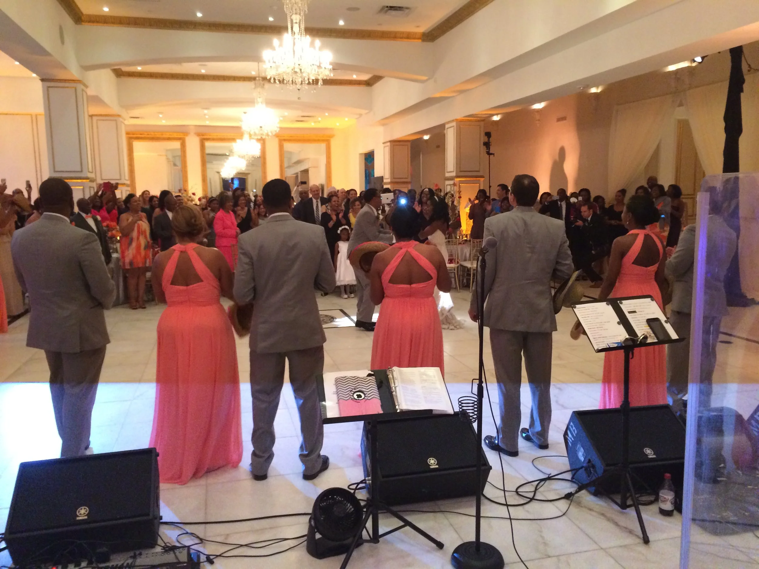 Band performing at a formal event with guests