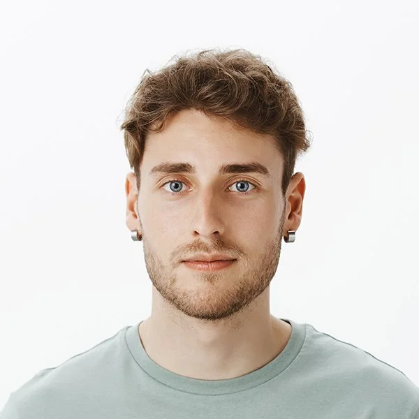 Standard U.S. passport photo for renewal applications — printed and digital copies available.