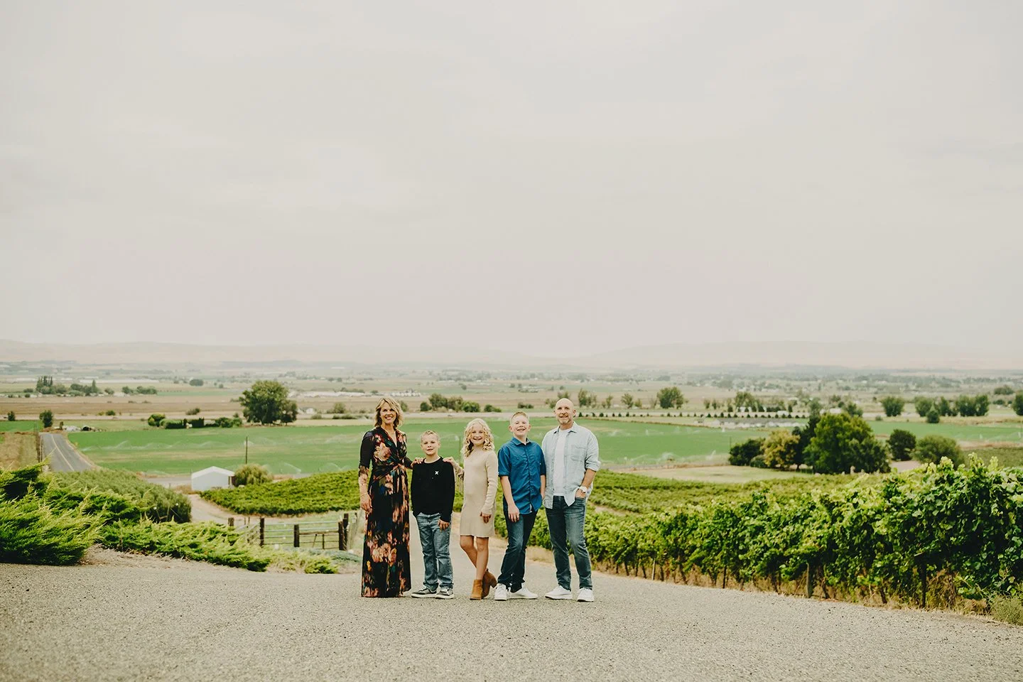 Yakima Valley family photo session in Sunnyside, WA — warm vineyard scenery, golden light, and natural, candid moments captured among the rows.