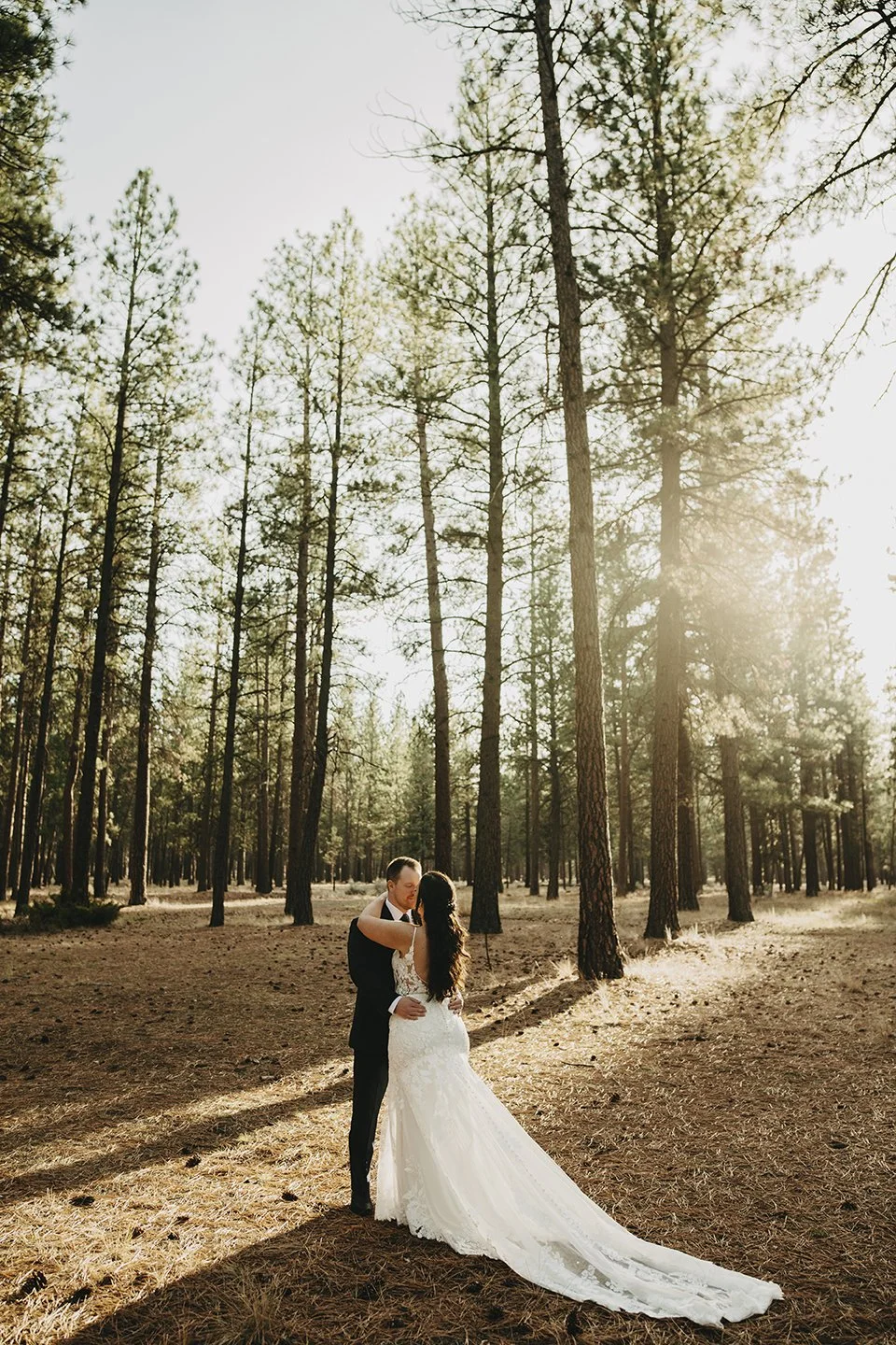 Bride and groom sharing a quiet moment under golden light Five Pine Lodge in Sisters, Oregon— part of Ob Cruz Photography’s wedding collections.