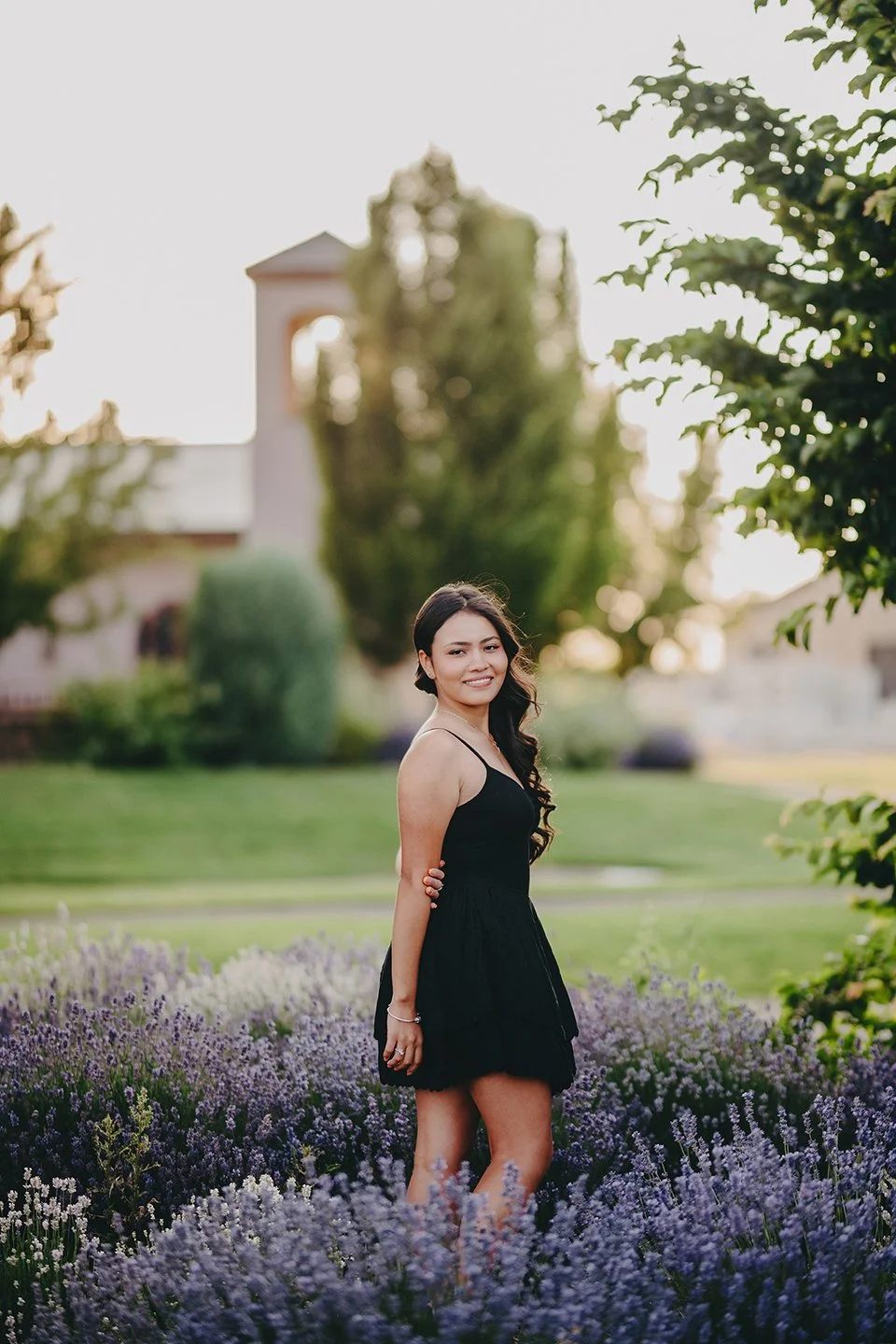 Senior photoshoot in a Tri-Cities vineyard — warm sunset light, natural movement, and elegant vineyard scenery.
