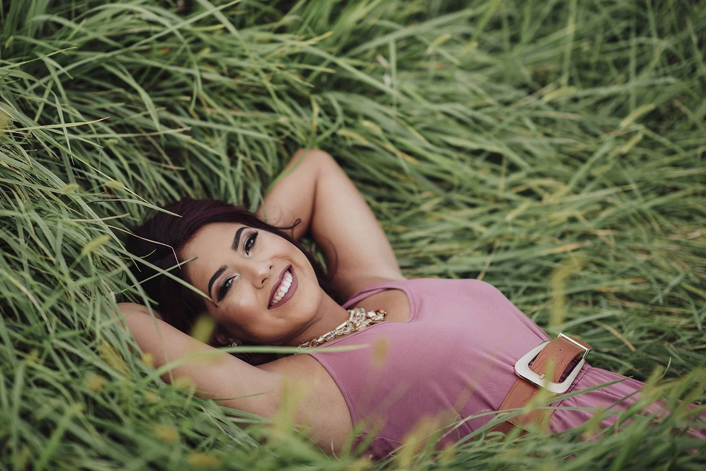 A dreamy soft-light senior portrait with warm Prosser tall-grass texture.