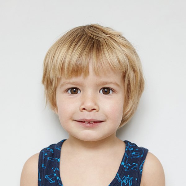 Child passport photo session at Ob Cruz Photography — family-friendly and quick.