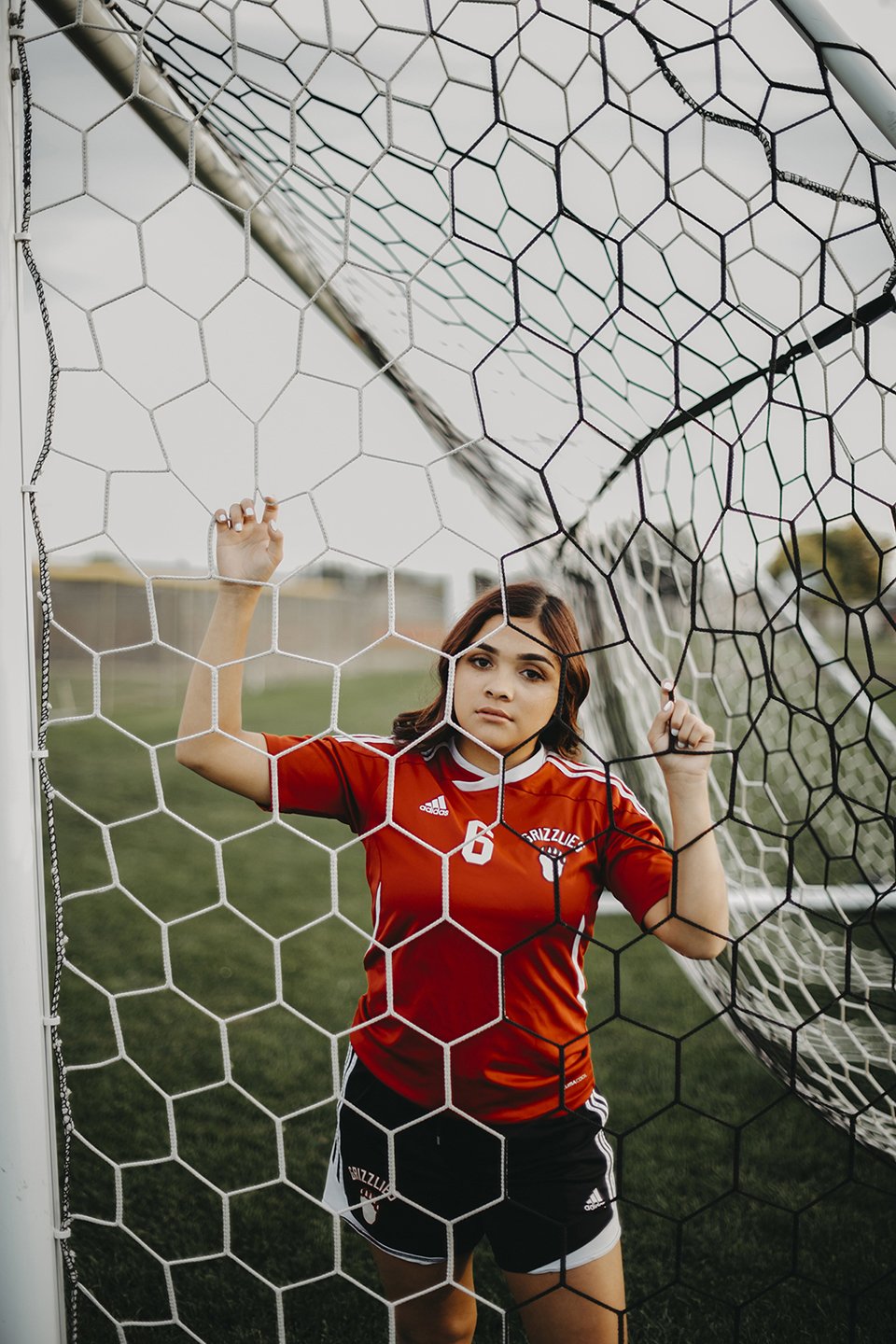 Athletic senior session at Sunnyside High School capturing her love for soccer.