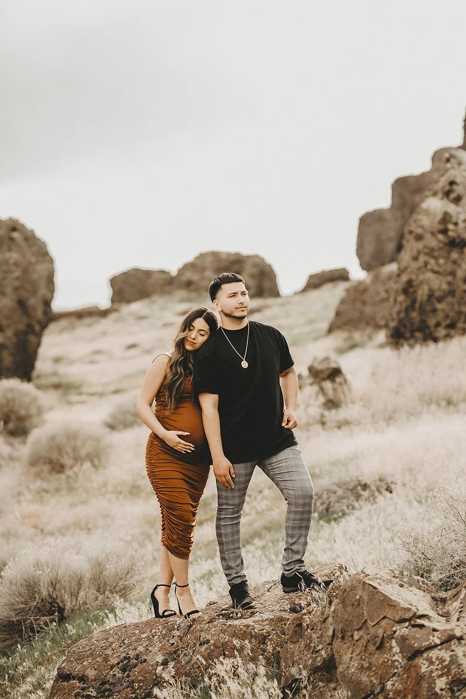 Elegant and full of love, this Benton City maternity portrait captures the mother-to-be resting gently against her partner, creating a warm and intimate moment.