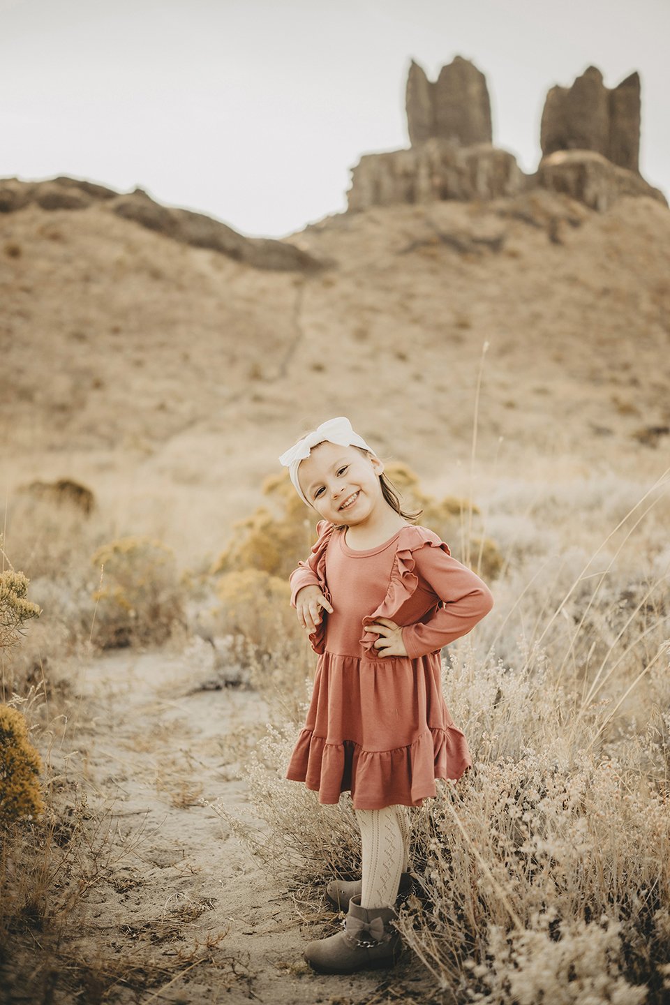 Sweet portrait of Gigi at the sand dunes in Twin Sisters Rocks, WA — soft light, warm tones, and a natural, joyful feel.