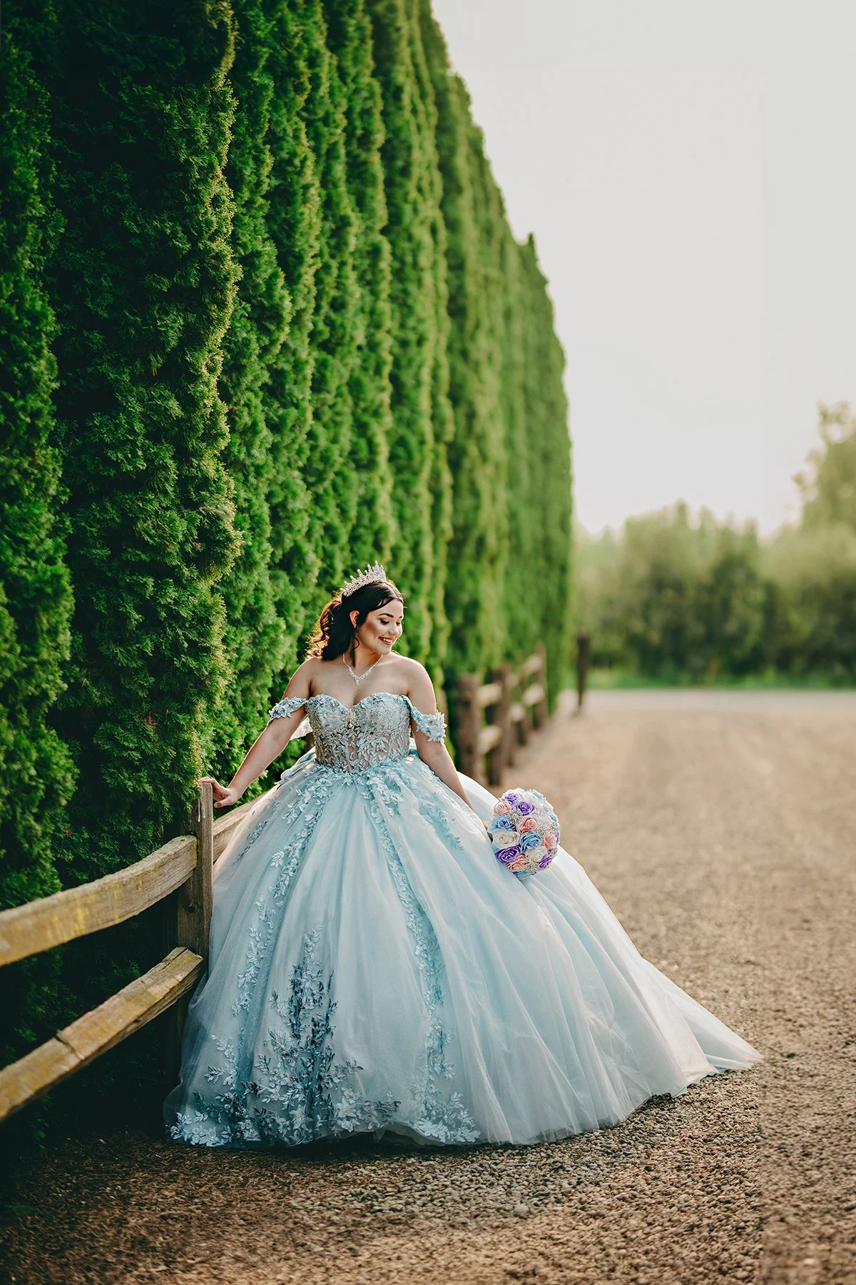 Amid the lush gardens of Le Jardin in Zillah, this quinceañera glows in soft blue — nature, light, and celebration intertwine in this elegant outdoor session.
