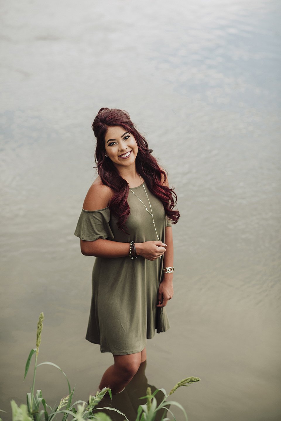 A soft summer senior session in Granger, WA with warm light, flowing water, and a natural, carefree feel.