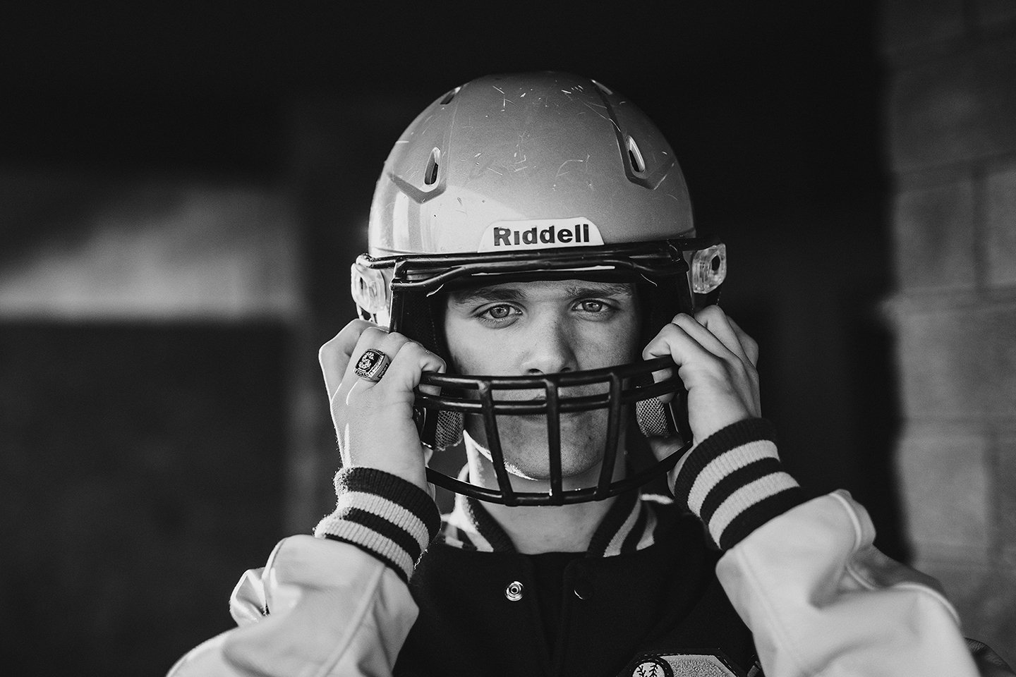 Strong, dramatic B&W football portrait of a Sunnyside Christian senior athlete.