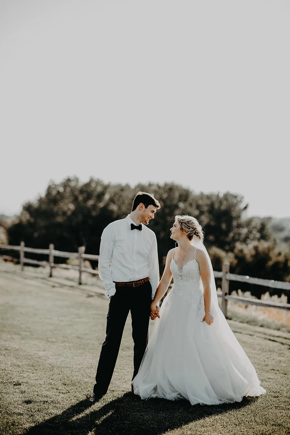 Bride and groom at sunset outside the Walter Clore Center in Prosser, WA — captured by Ob Cruz Photography.