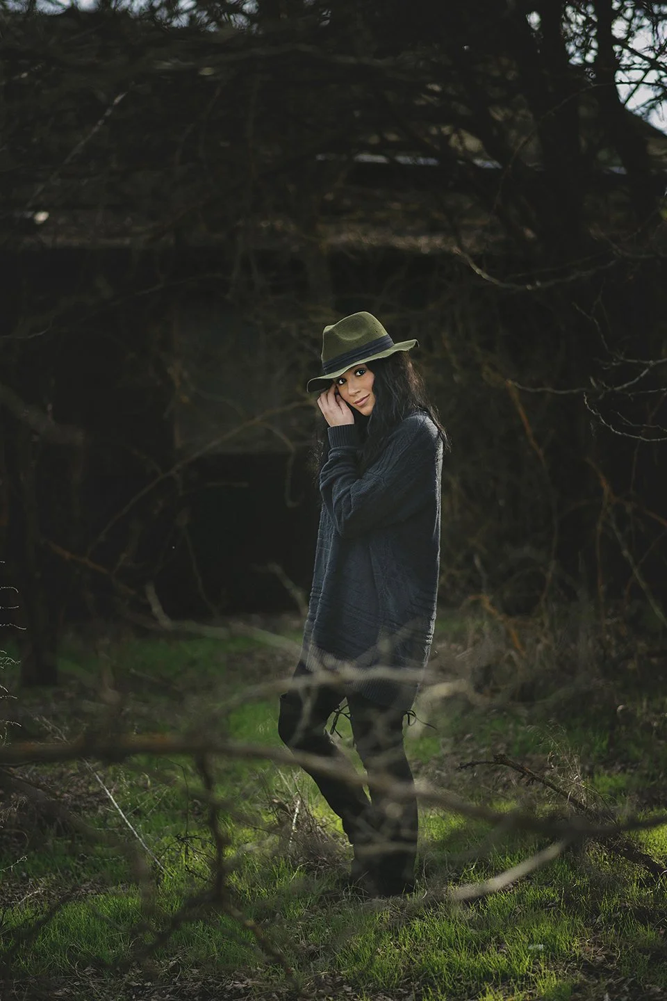Editorial senior portrait of Cora in an oversized black sweater in Granger, WA — clean light, simple styling, and a modern, minimal feel.