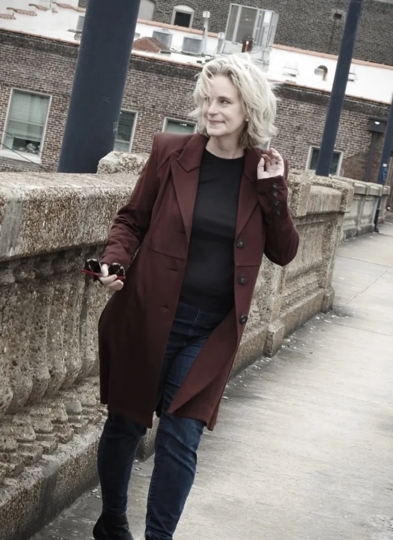 Woman with blonde hair in industrial area