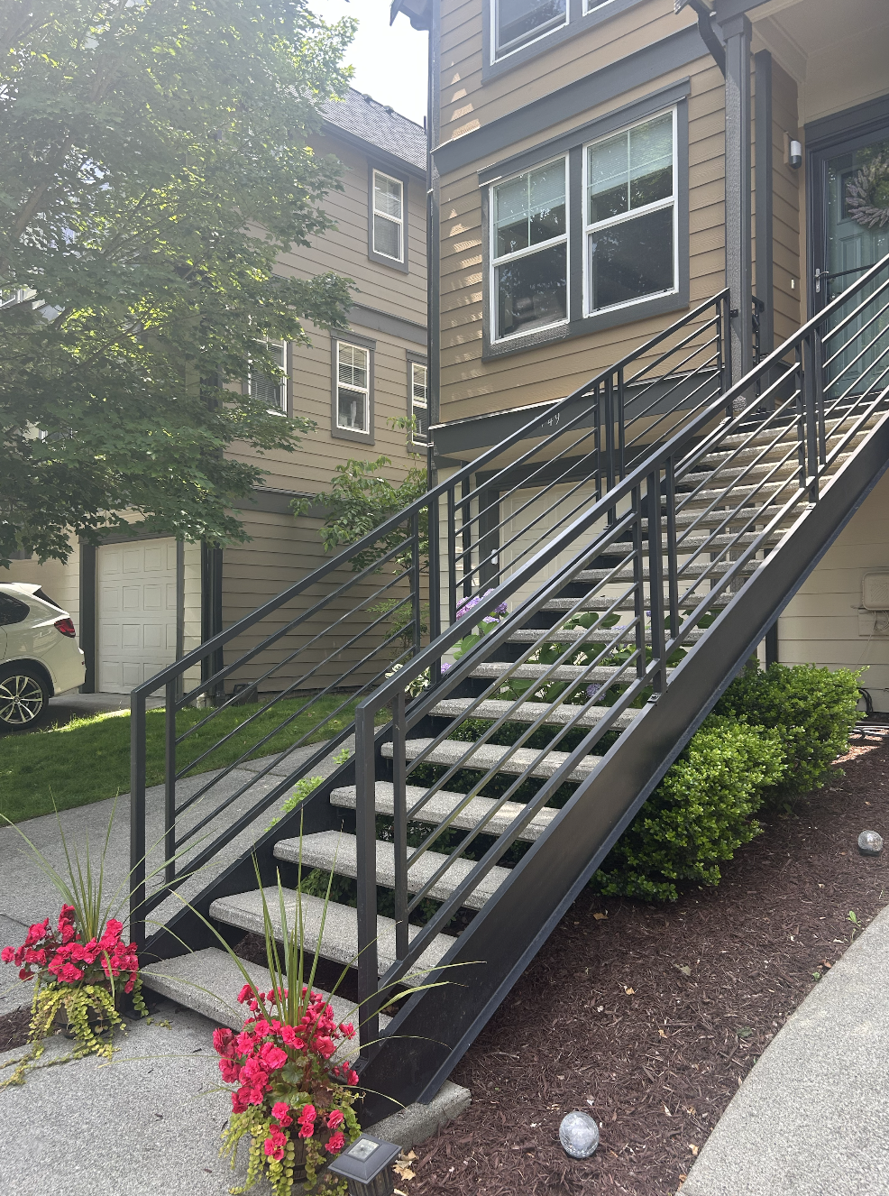 Custom metal staircase with powder-coated steel frame and wood treads